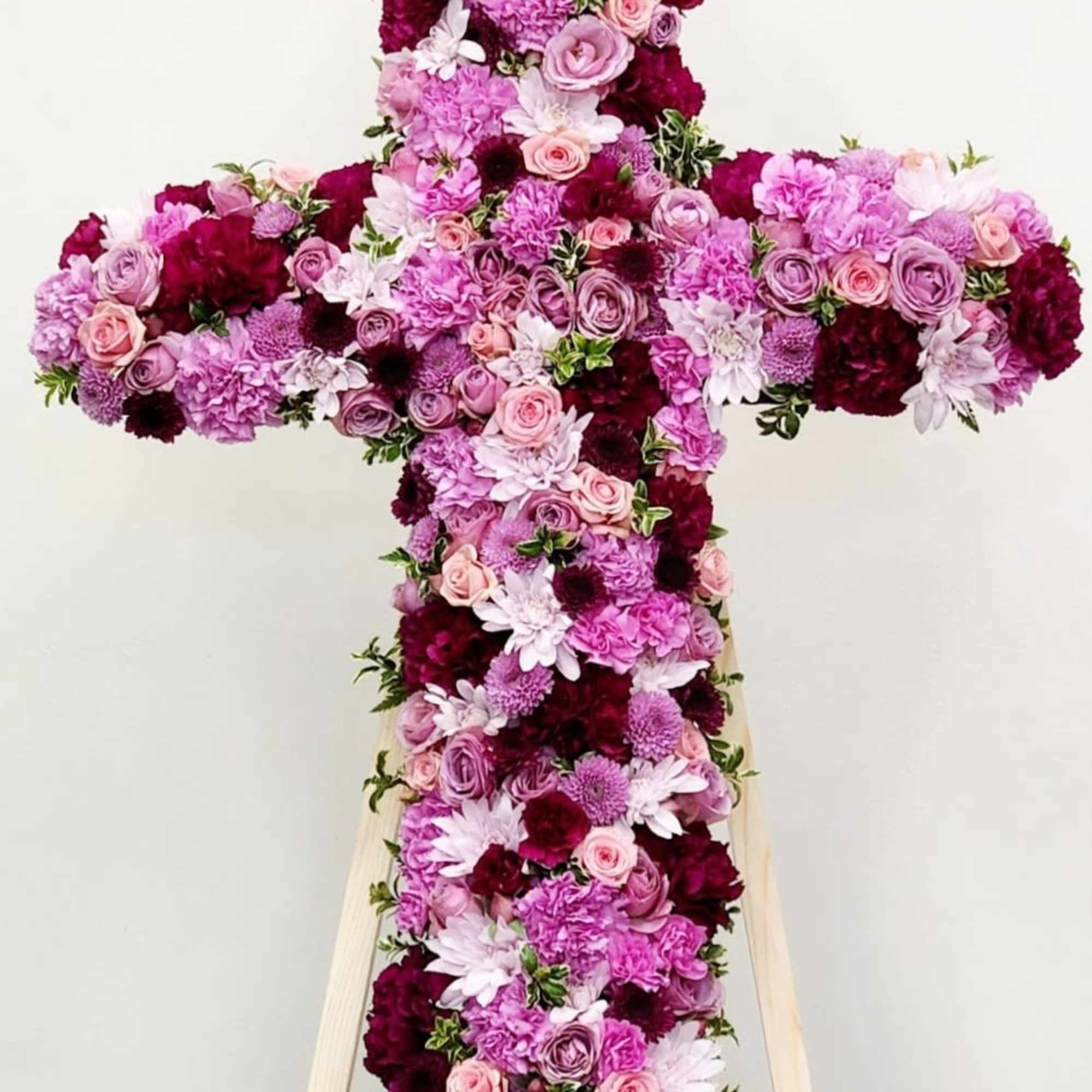 The Faithful Cross is a stunning tribute arrangement crafted to honor and