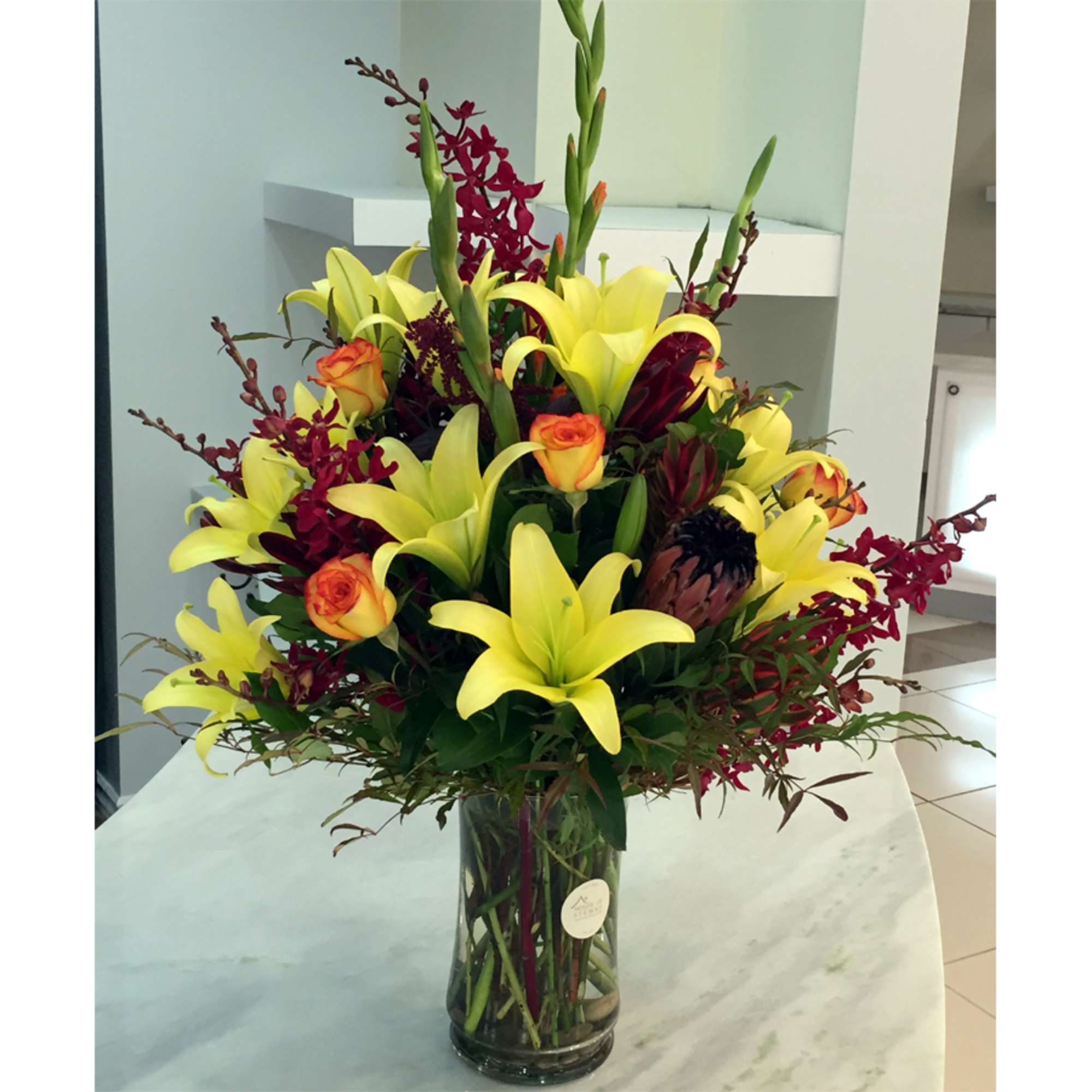 The Firecracker Bouquet &ndash; Exotic Orchids, Proteas, Lilies &amp; Roses

Turn up the