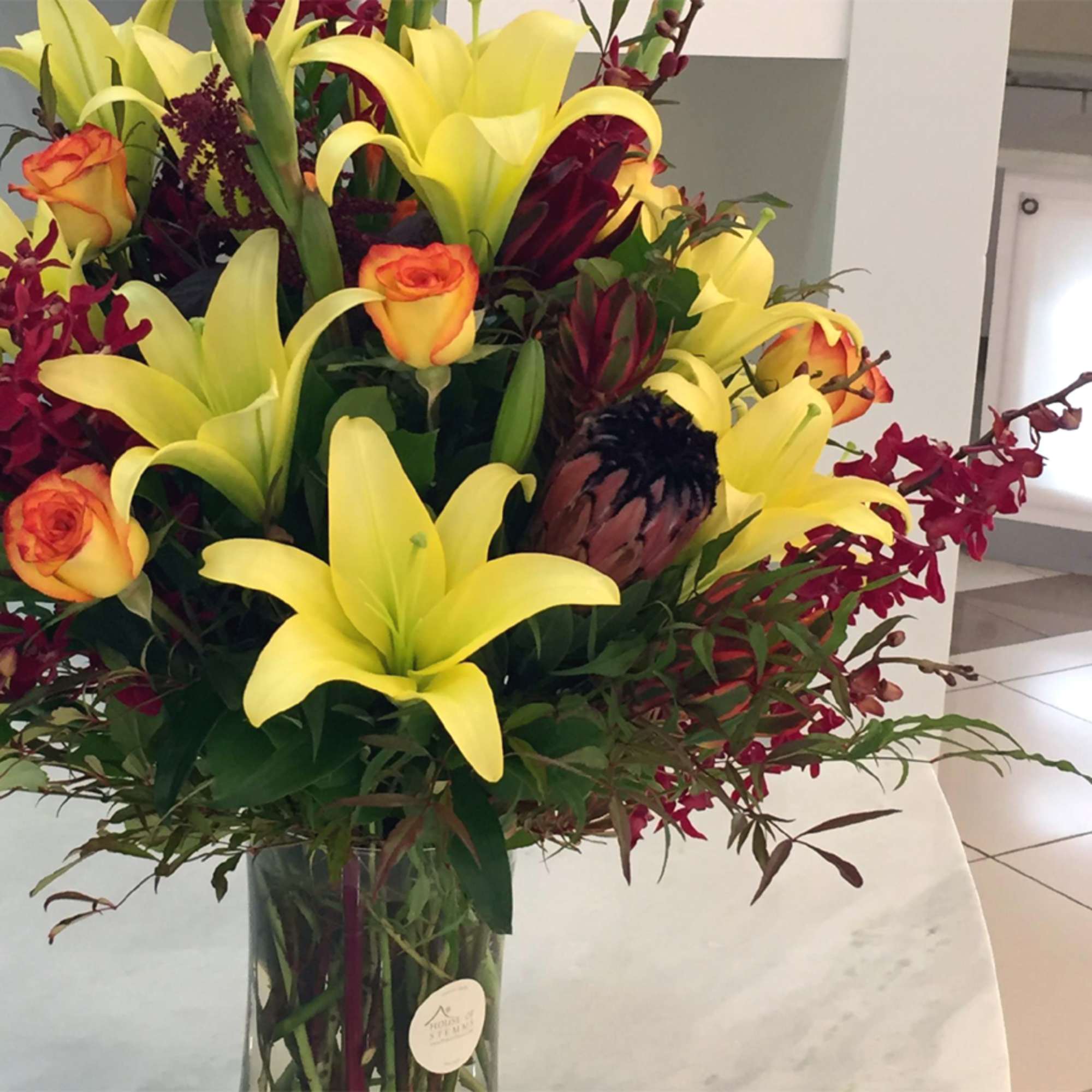 The Firecracker Bouquet &ndash; Exotic Orchids, Proteas, Lilies &amp; Roses

Turn up the
