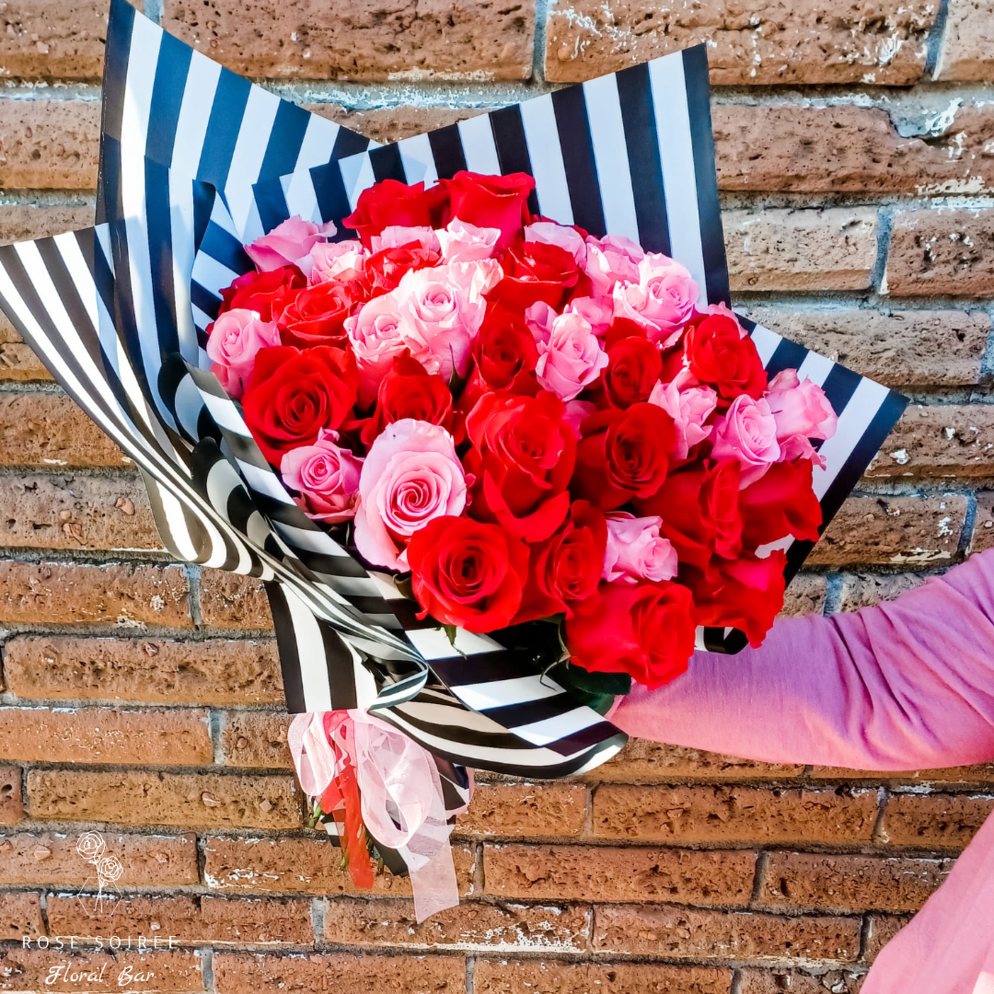 Your love will swoon over this enormous bouquet of 50 roses. Half