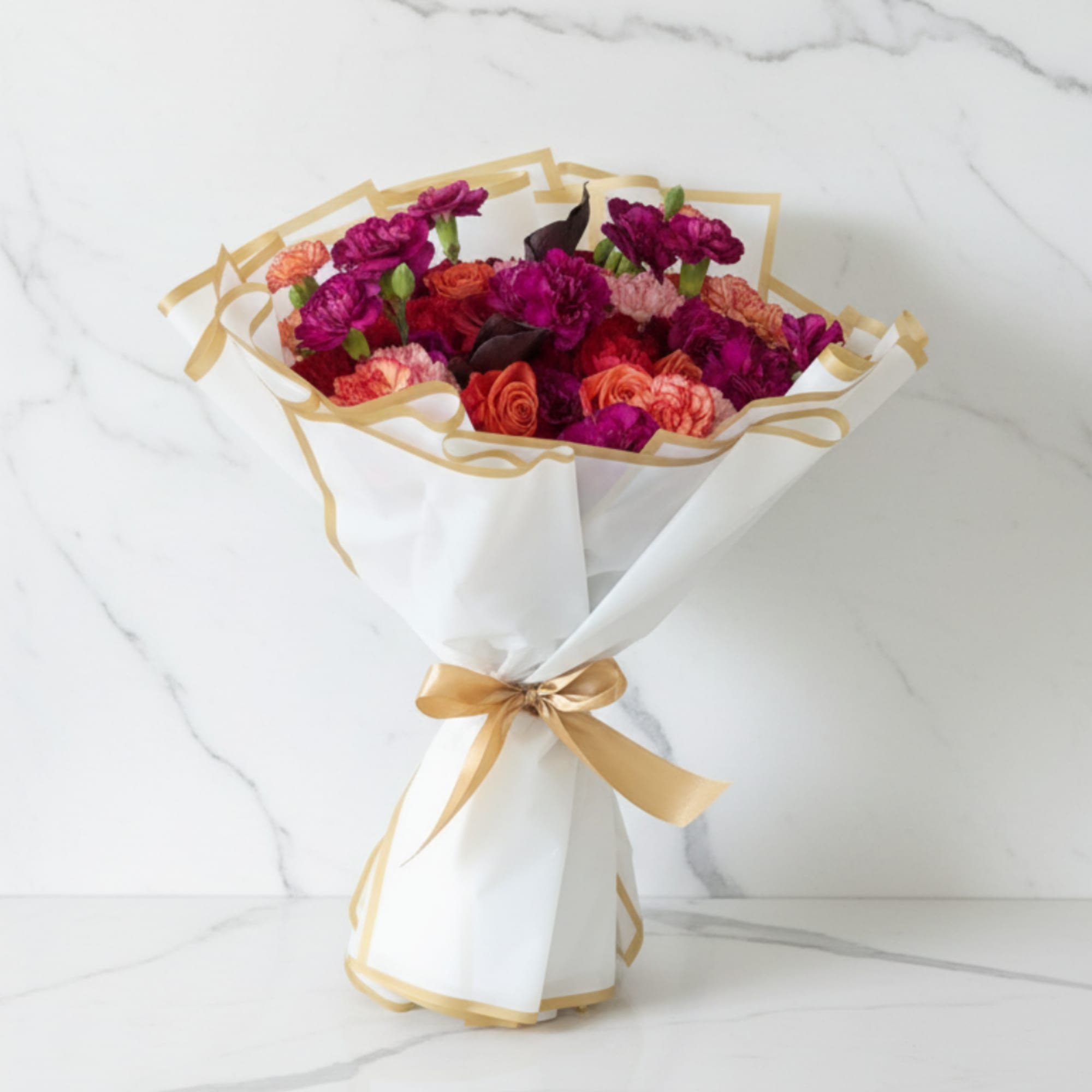 A bold hand-tied bouquet that radiates elegance and passion. Featuring deep red