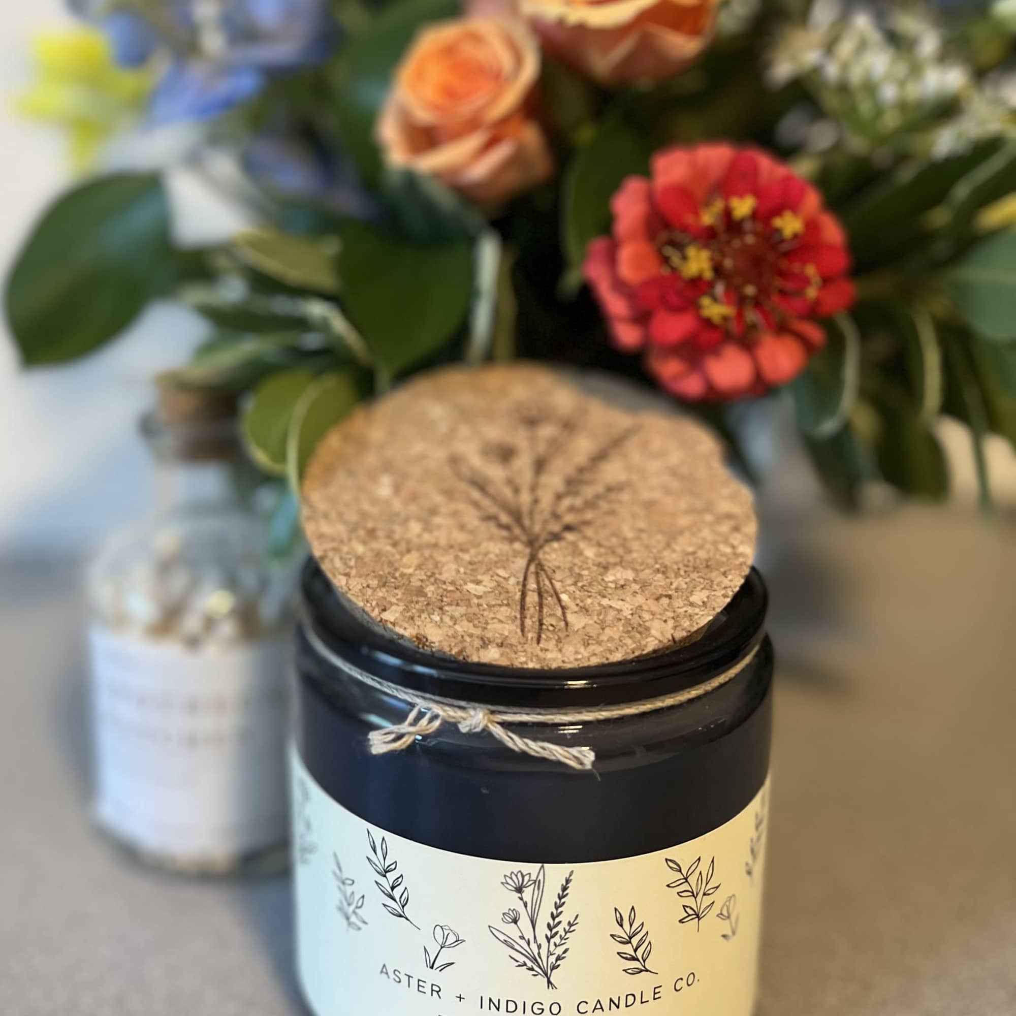 1 Fall candle from Aster &amp; co
1 Petite Designers Choice Arrangement
1 Apothecary