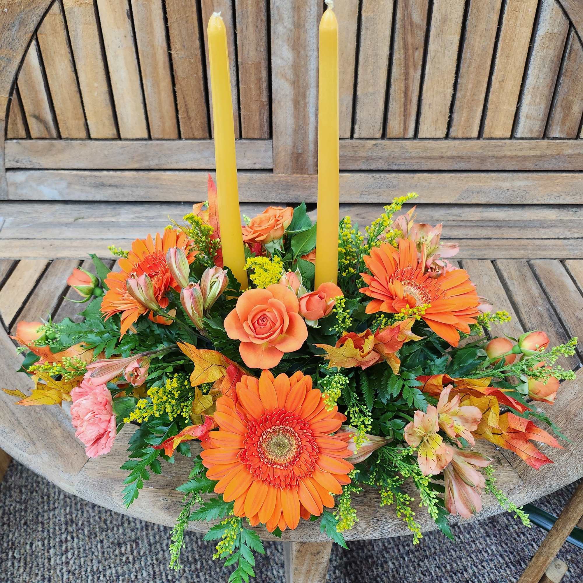 Mixed fall flowers with candles
