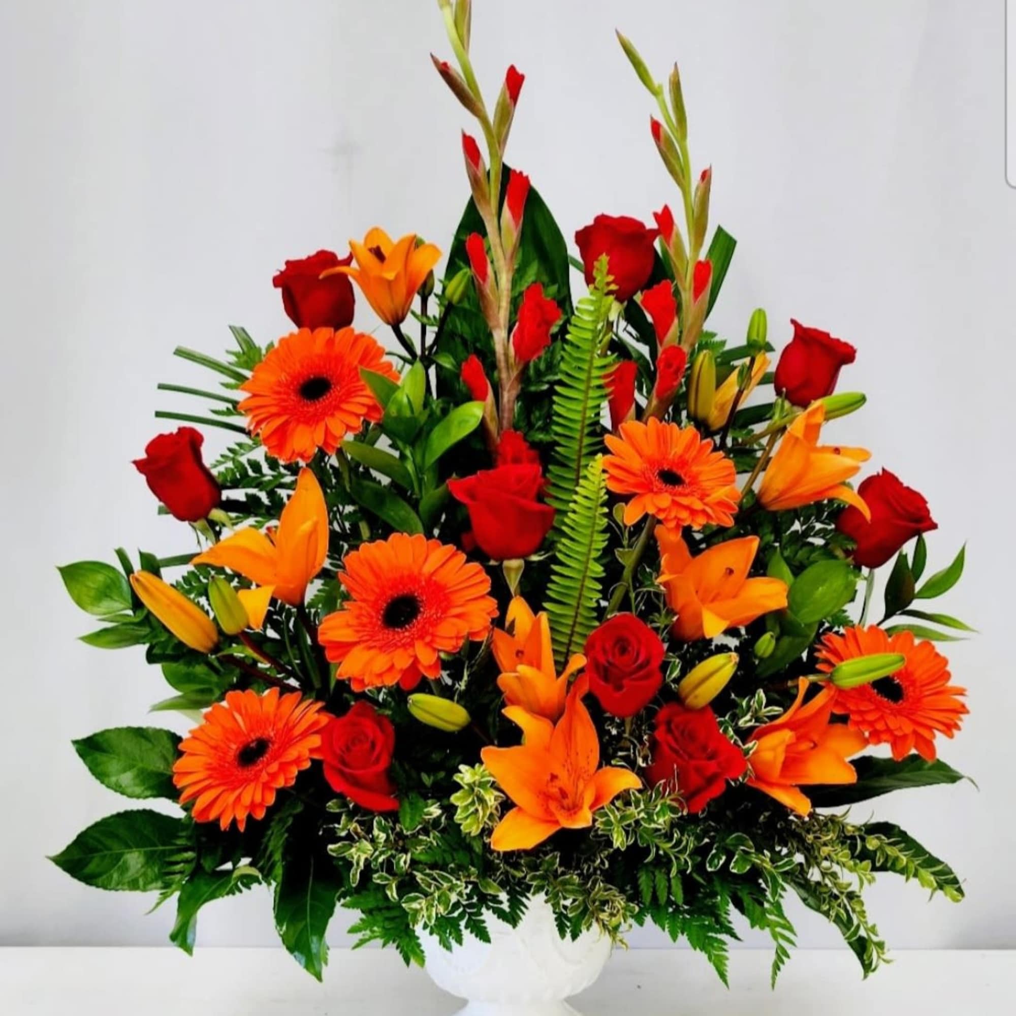 Celebrate life&#039;s vibrant moments with this stunning arrangement of rich oranges and