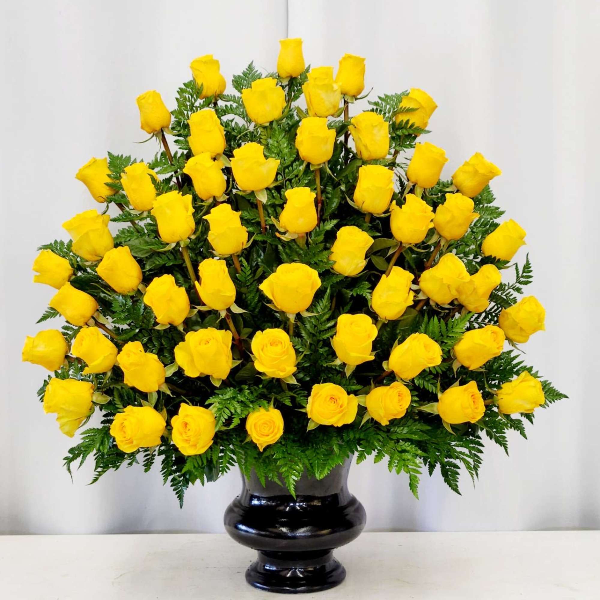Brighten any moment with this stunning arrangement of four dozen vibrant yellow