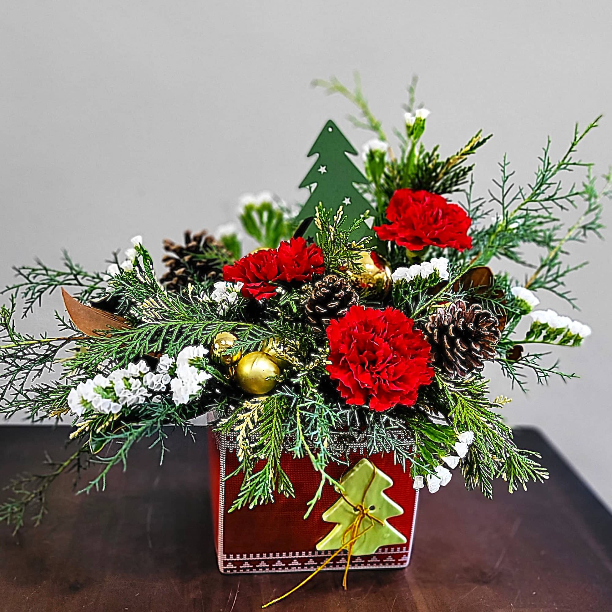 Wrap the holidays with a gift box arrangement of lush pine evergreens