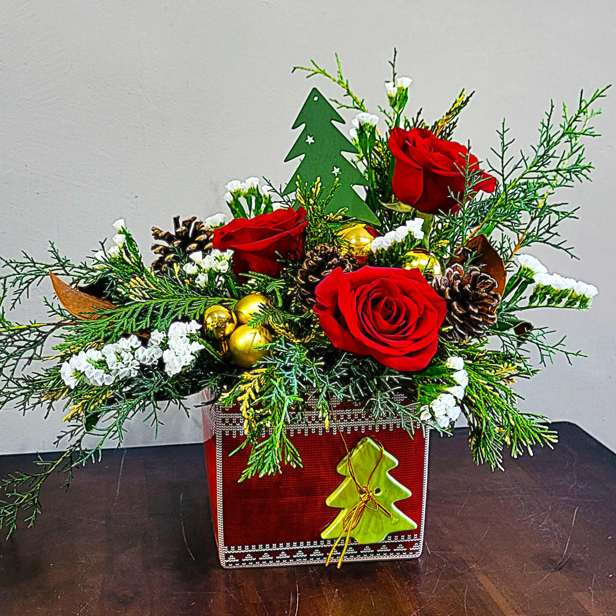 Wrap the holidays with a gift box arrangement of lush pine evergreens
