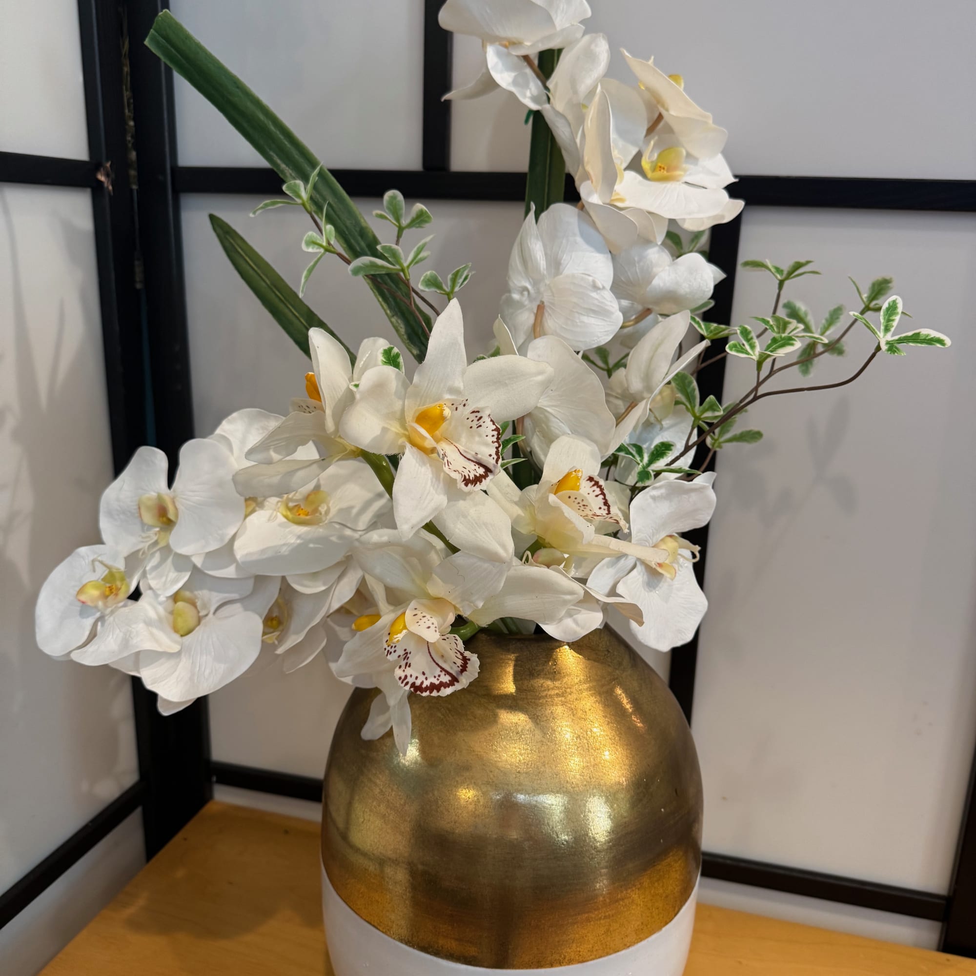 You may order this arrangement with silk orchids as pictured, a plant
