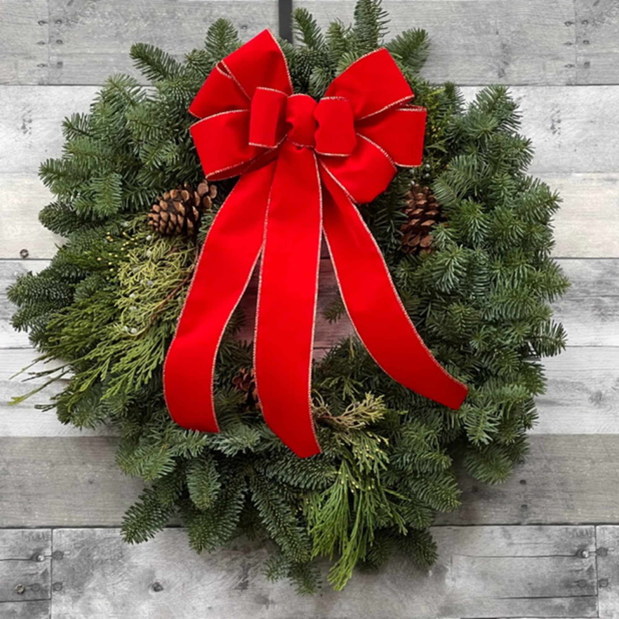 24&quot; Noble fir wreath, with holiday bow.  The Deluxe and Premium