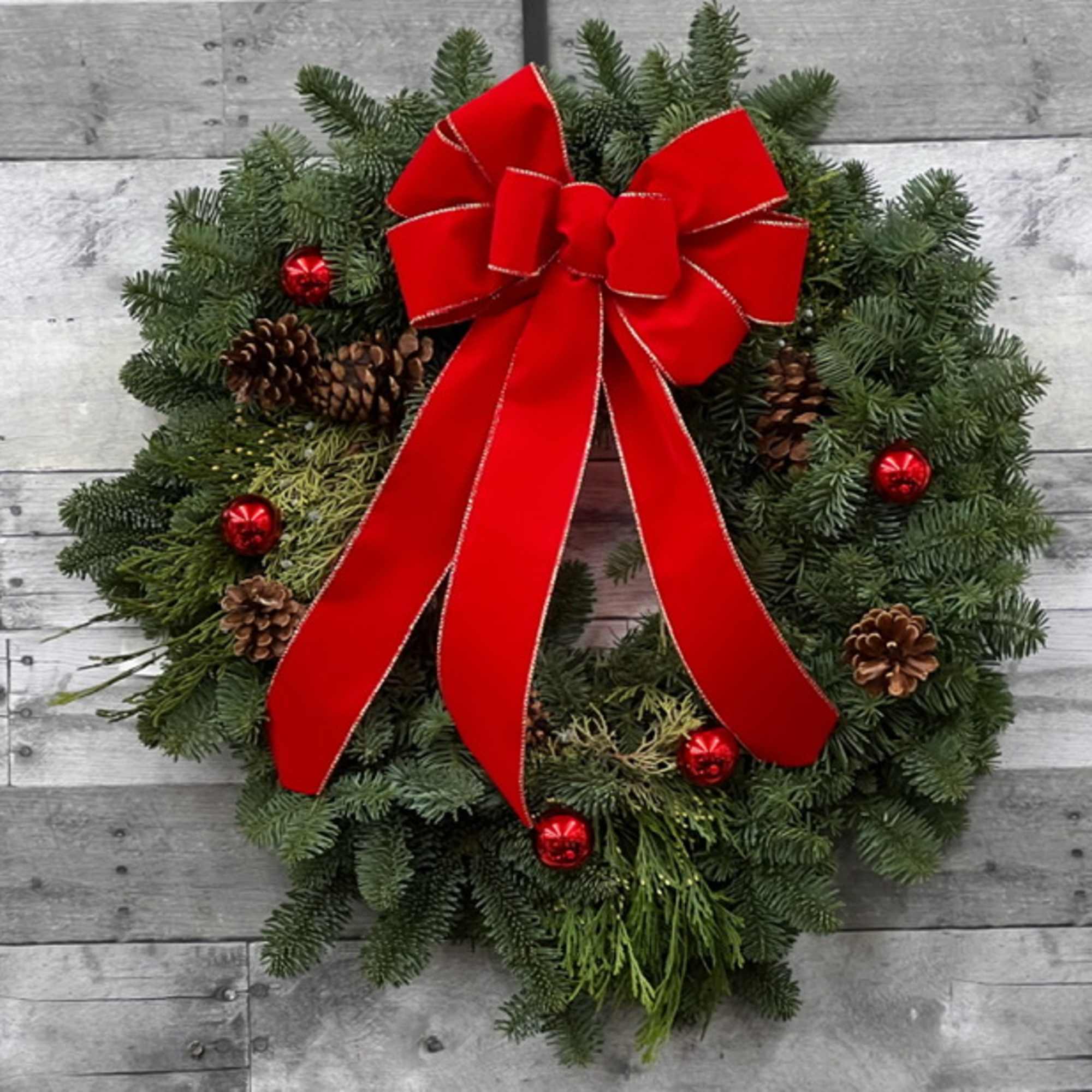 24&quot; Noble fir wreath, with holiday bow.  The Deluxe and Premium