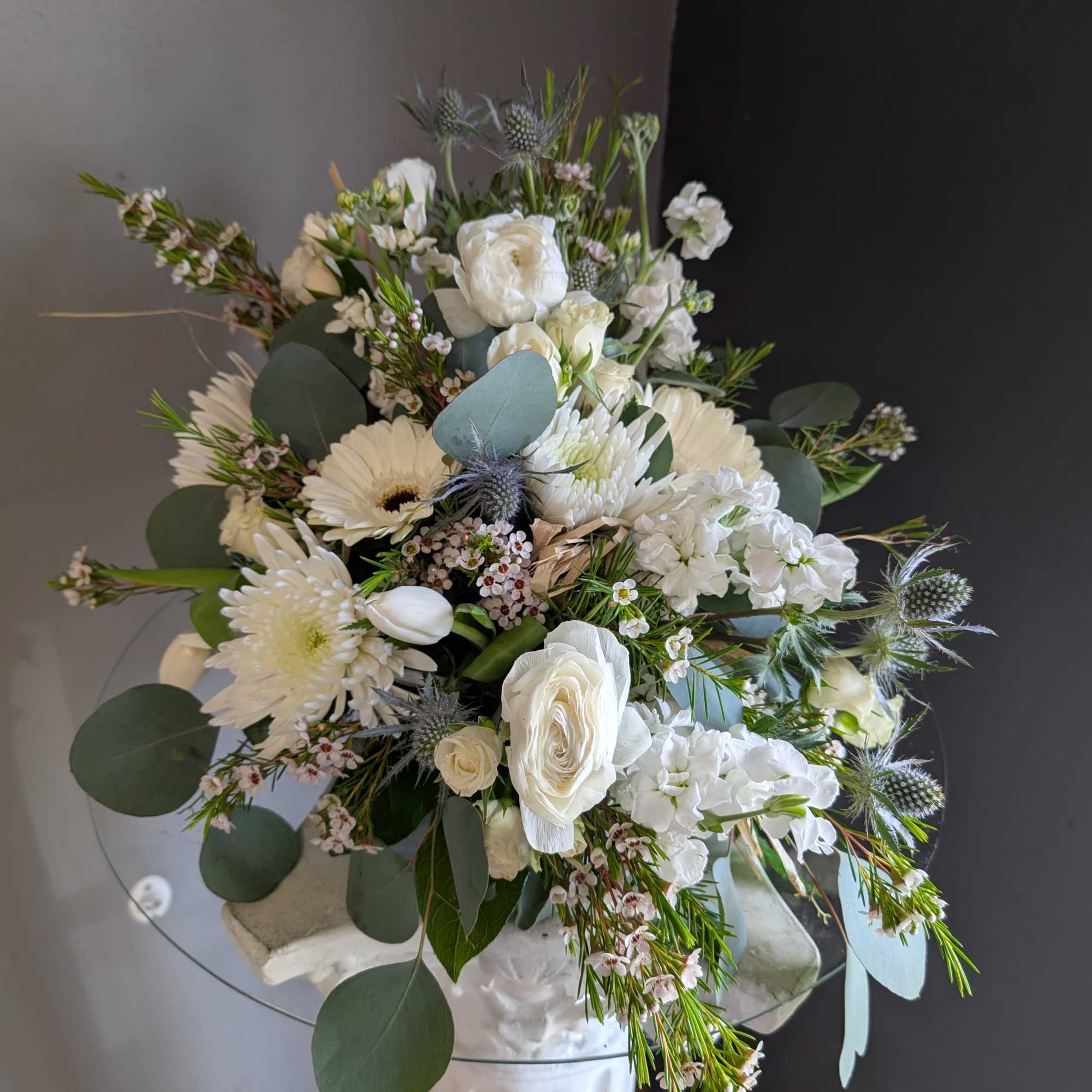 Beautiful arrangement of fresh flowers displayed inside a cornocopia 