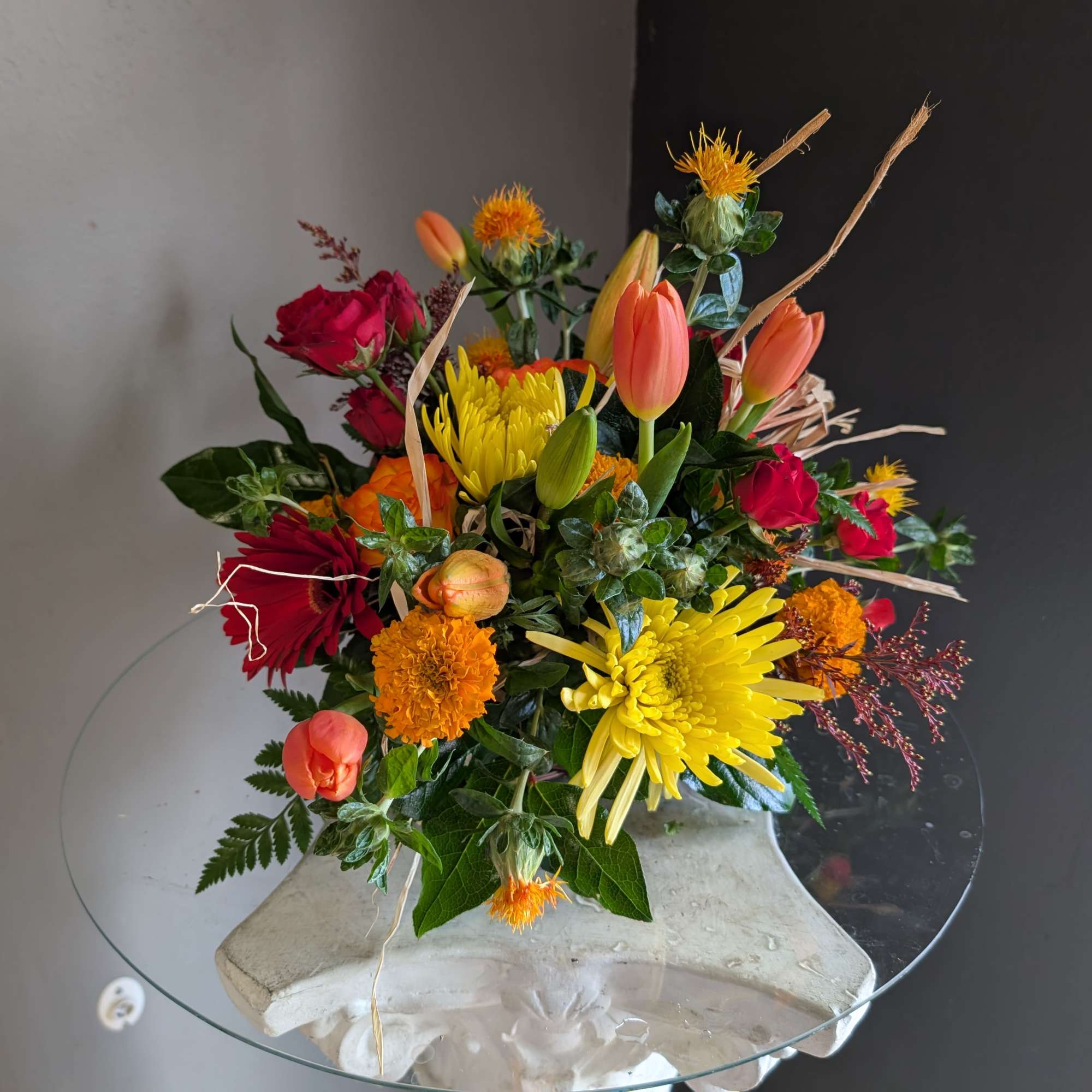 Beautiful arrangement of fresh flowers displayed inside a cornocopia 