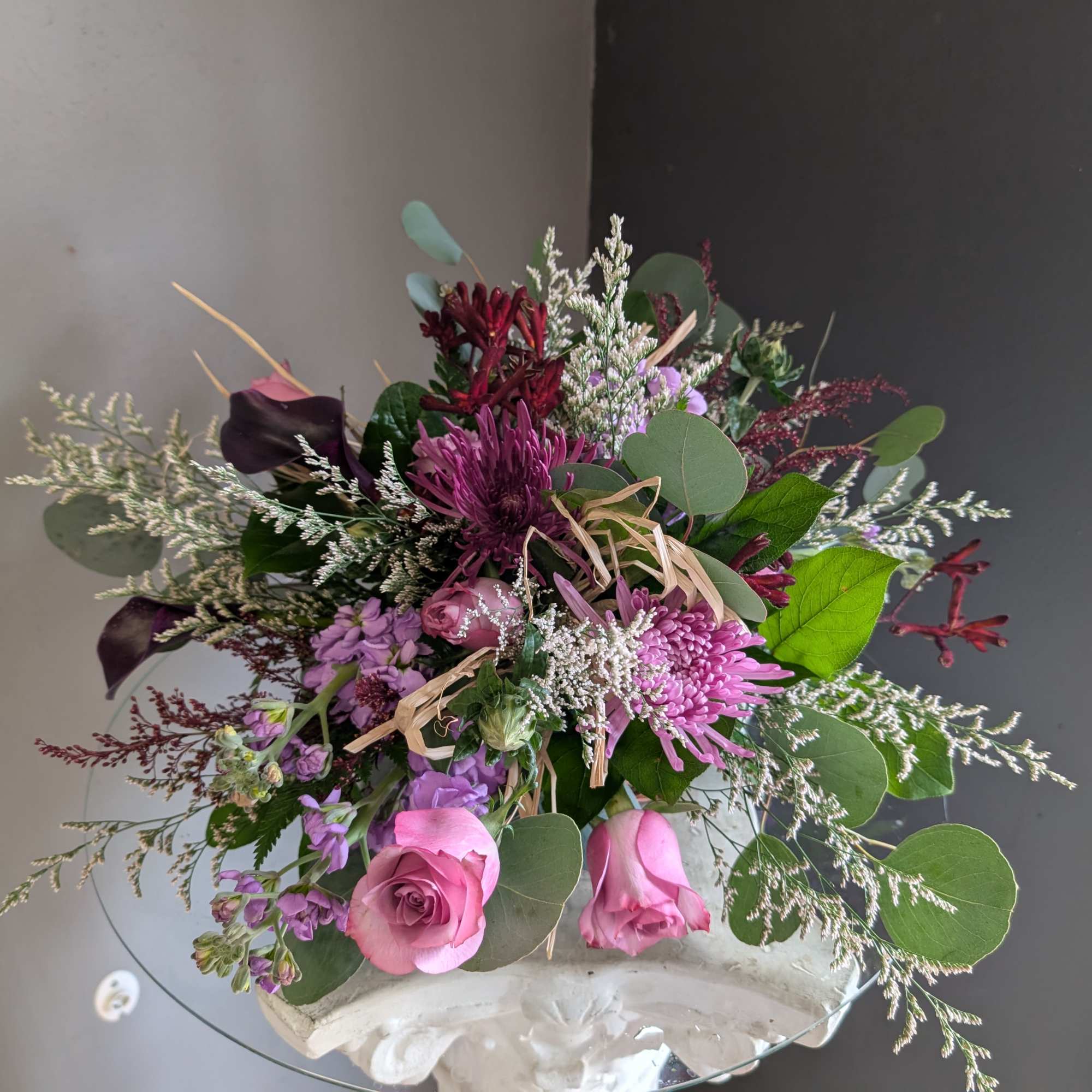 Beautiful arrangement of fresh flowers displayed inside a cornocopia 