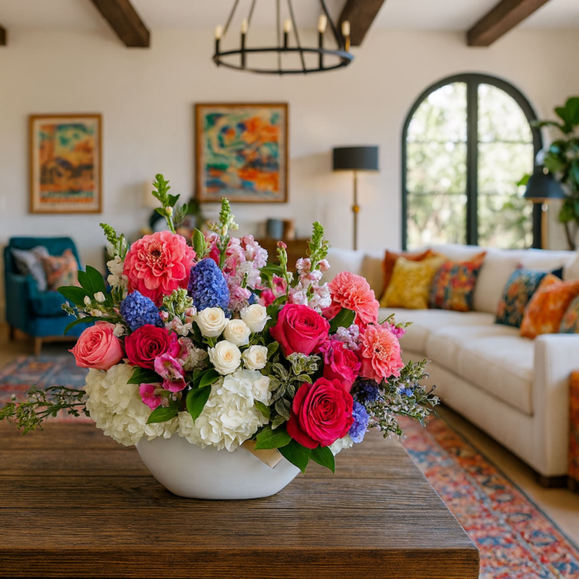 Our Bina Arrangement is a colorful and cheerful arrangement inspired and named