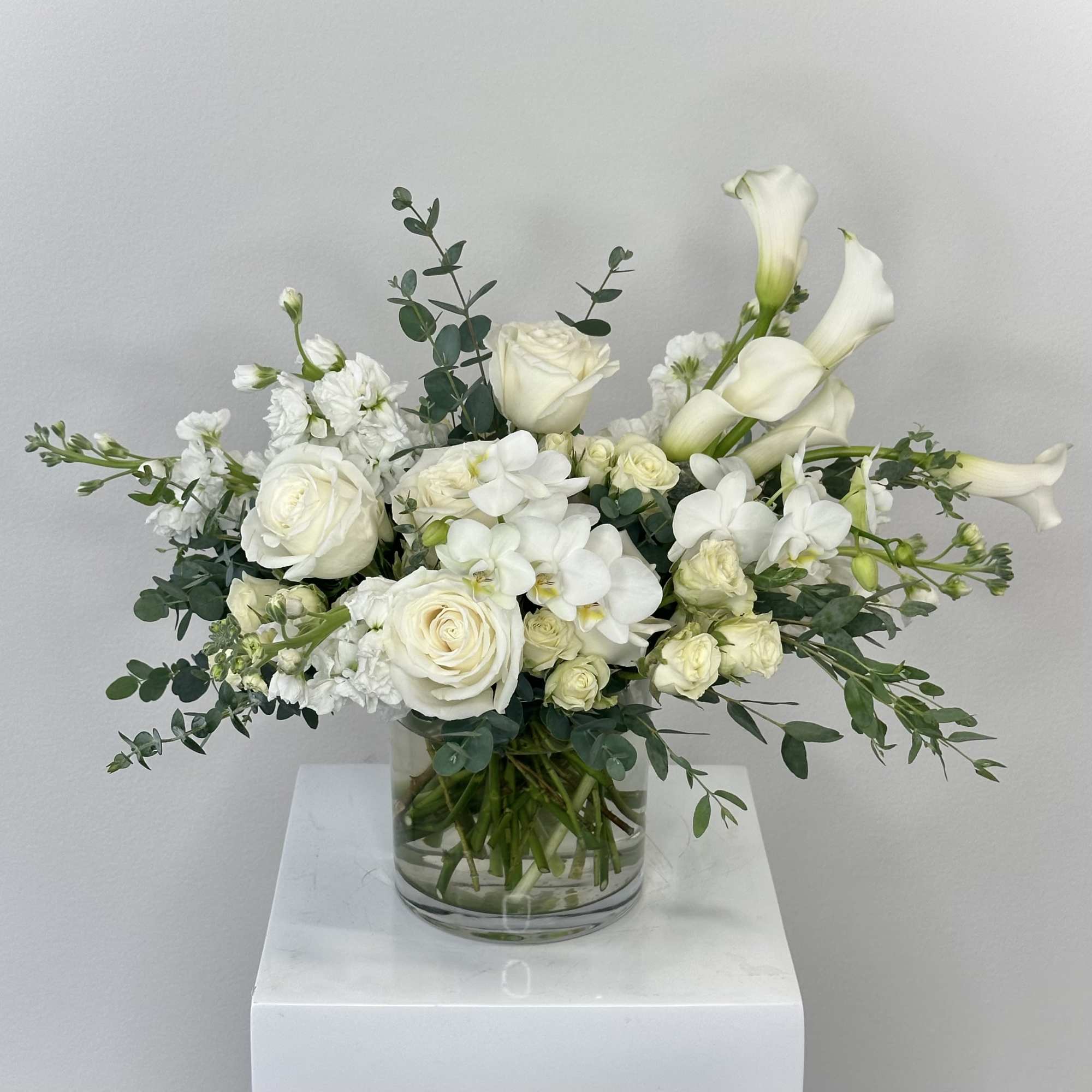 An elegant and sophisticated white arrangement from our parent company, Fleurs de