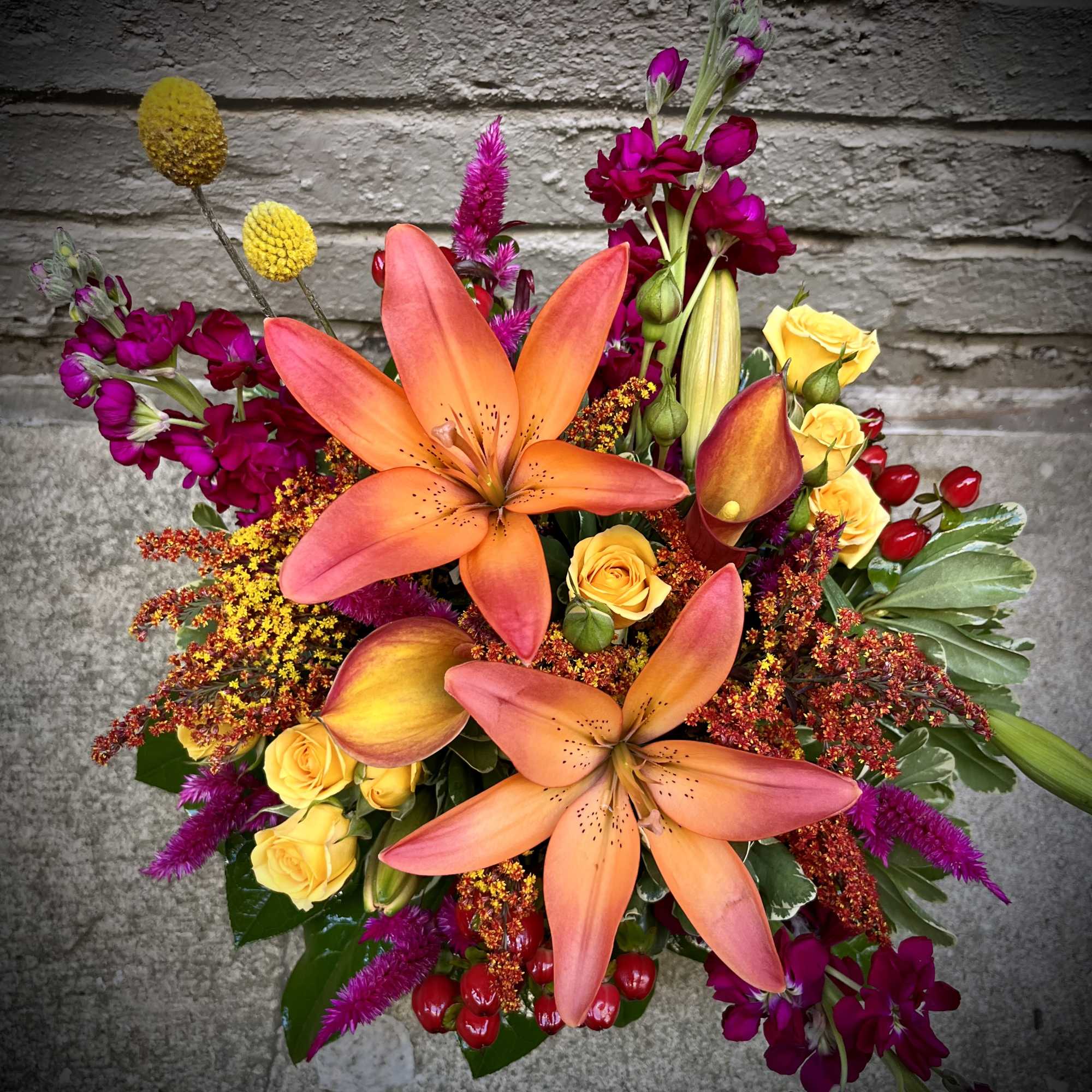 Gorgeous tones of reds, oranges, yellows and fuchsias are combined to create