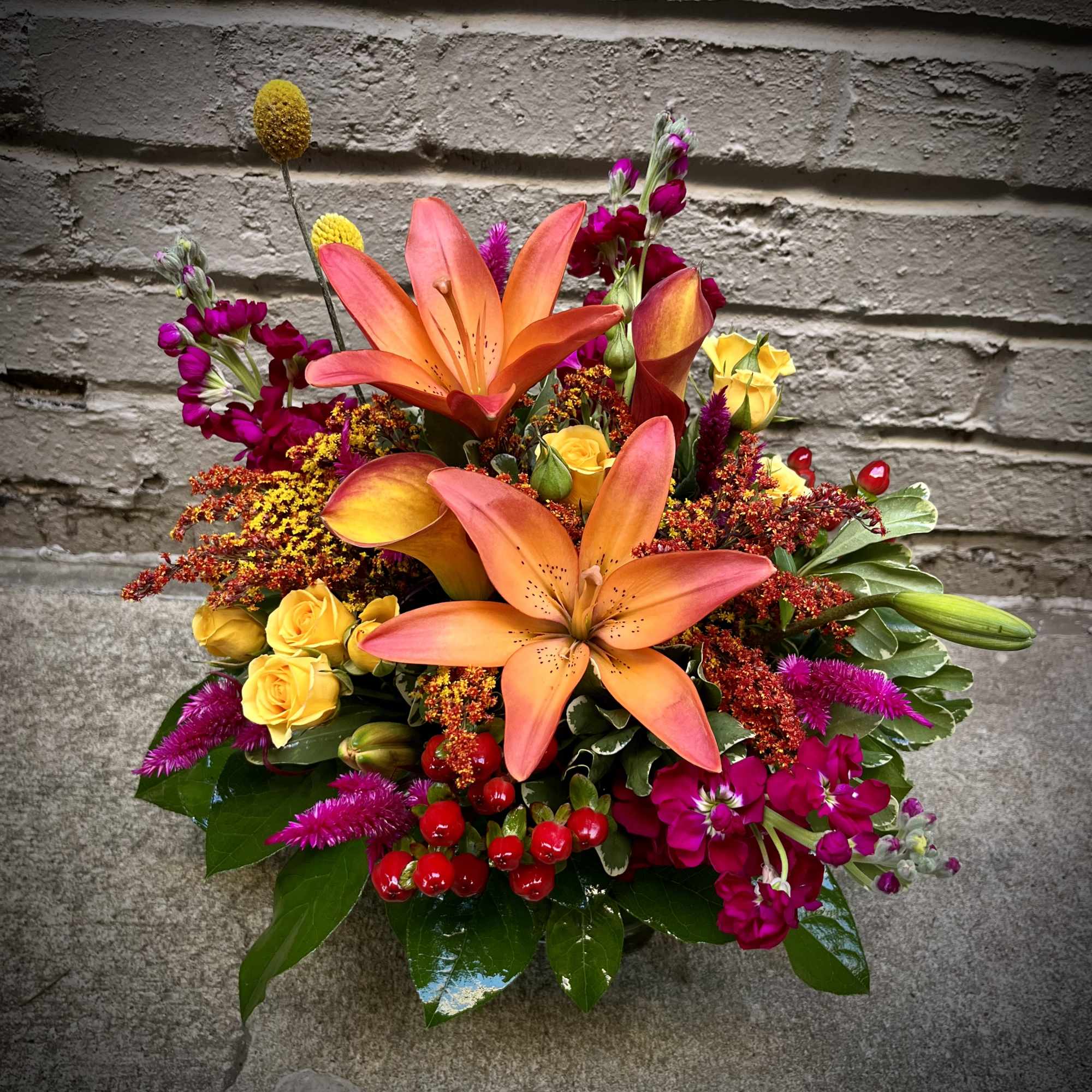 Gorgeous tones of reds, oranges, yellows and fuchsias are combined to create