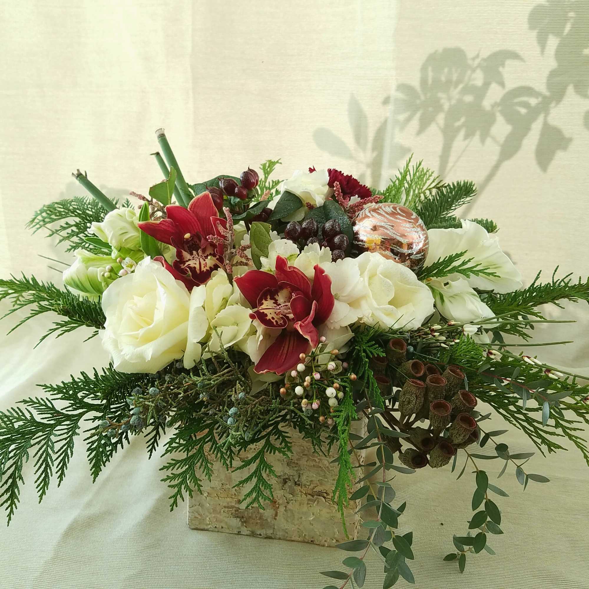 Gorgeous and stylish, this arrangement of hydrangeas, silver tinted roses, cymbidium orchids