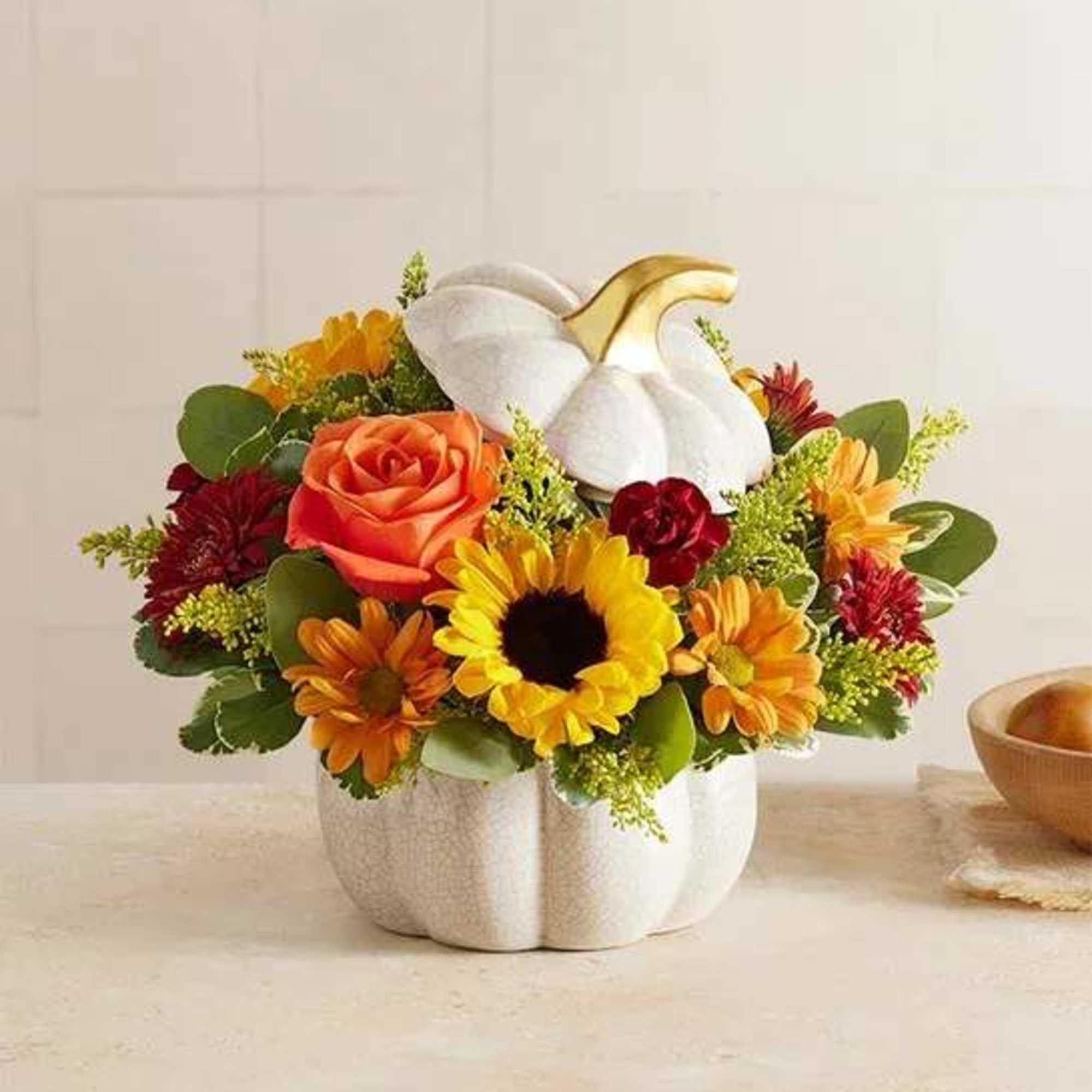 A plentiful mix of blooms gives our autumn arrangement an undeniable charm.