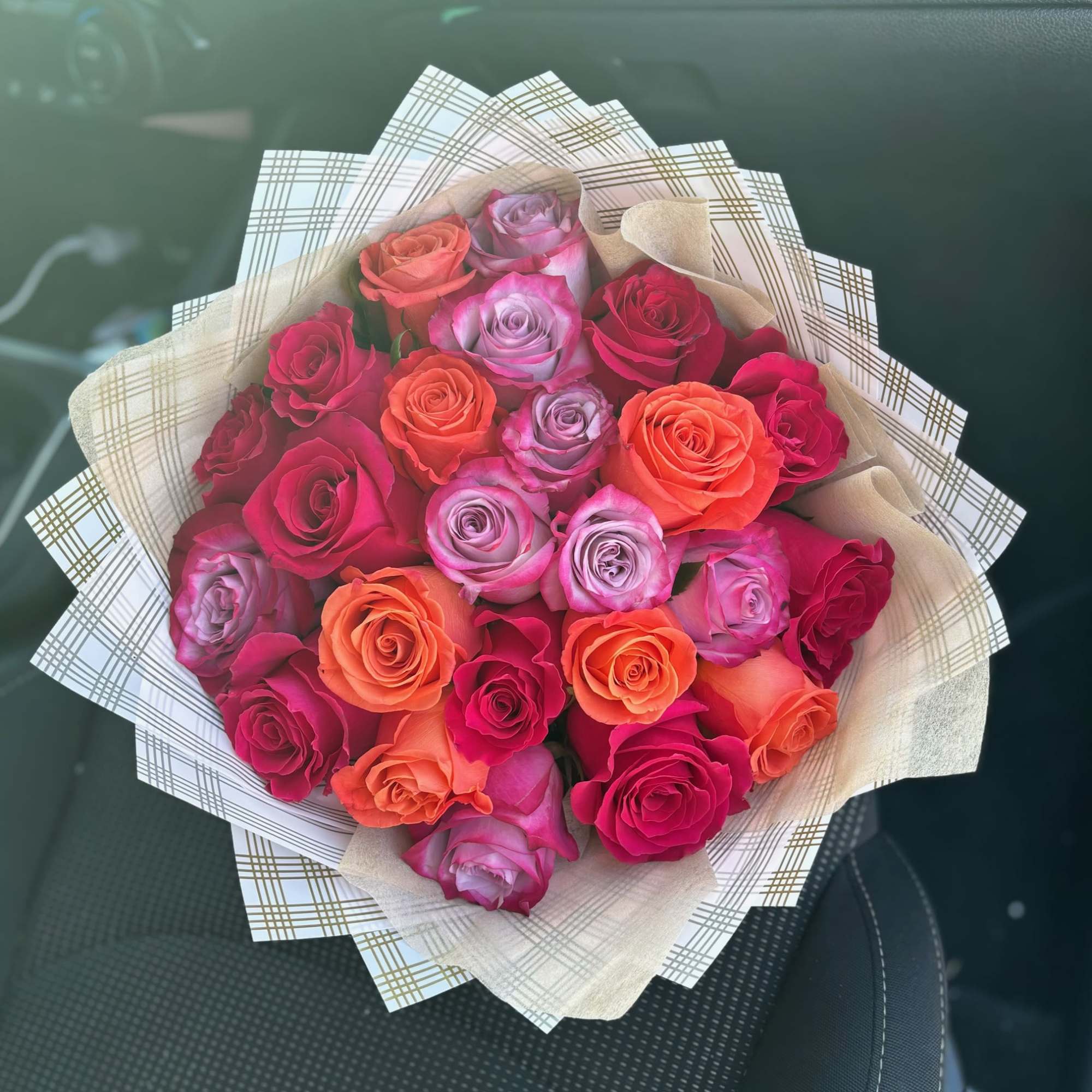 Beautiful bright and alive lavender, Orange, and a deep fushia roses, all