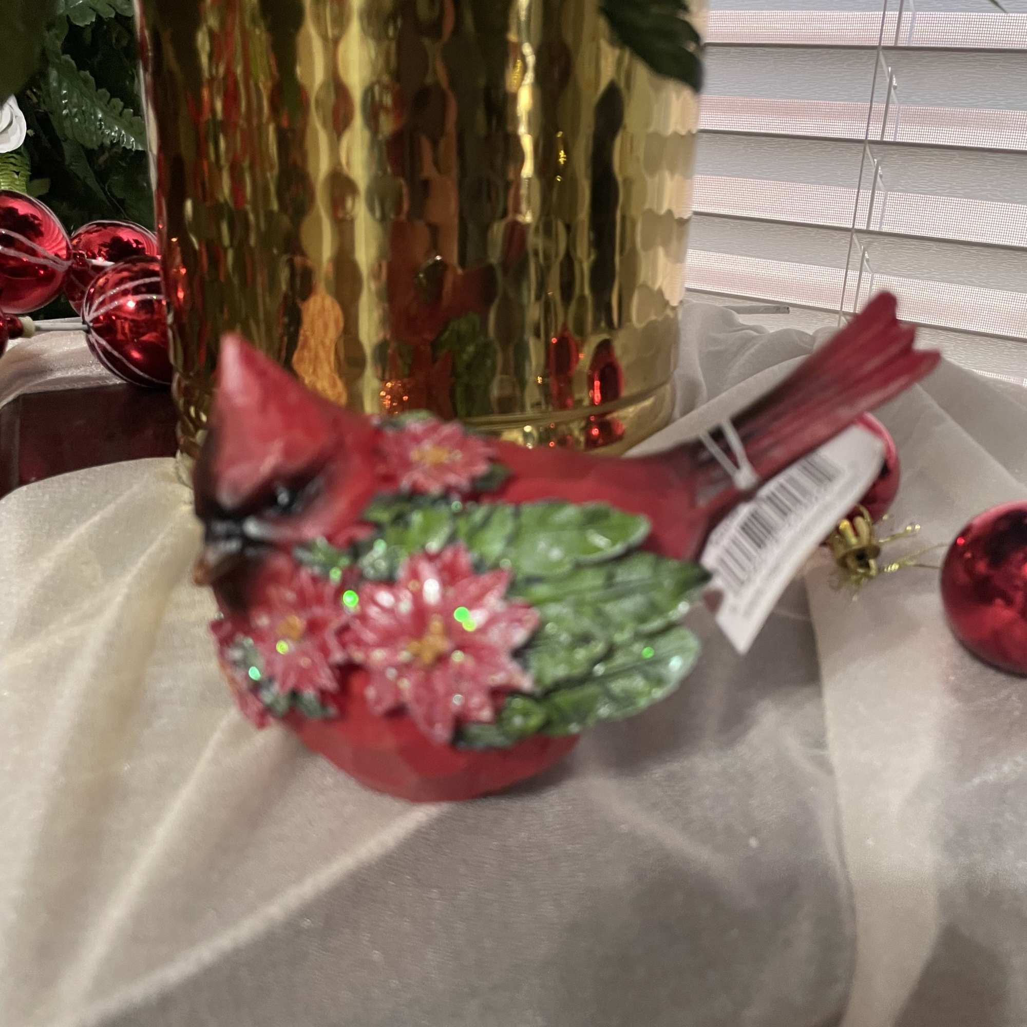 Sweet Cardinal with a Christmas wreath around his neck. A sweet festive