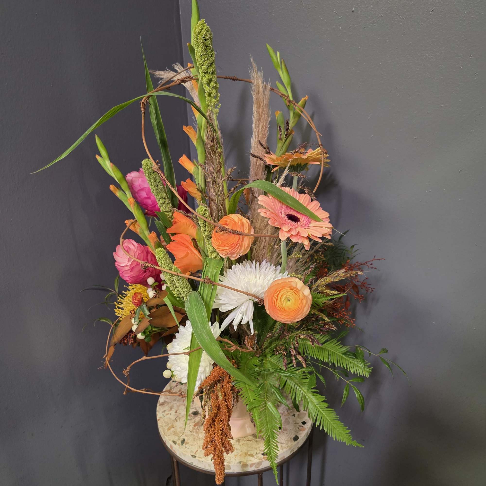 Introducing our Fiery Pumpkin Spice  &mdash; a tall, sculptural fall arrangement