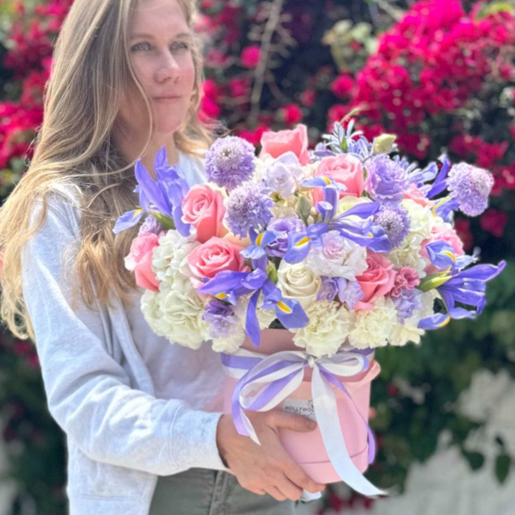 This elegant pastel arrangement combines the gentle charm of pink roses with