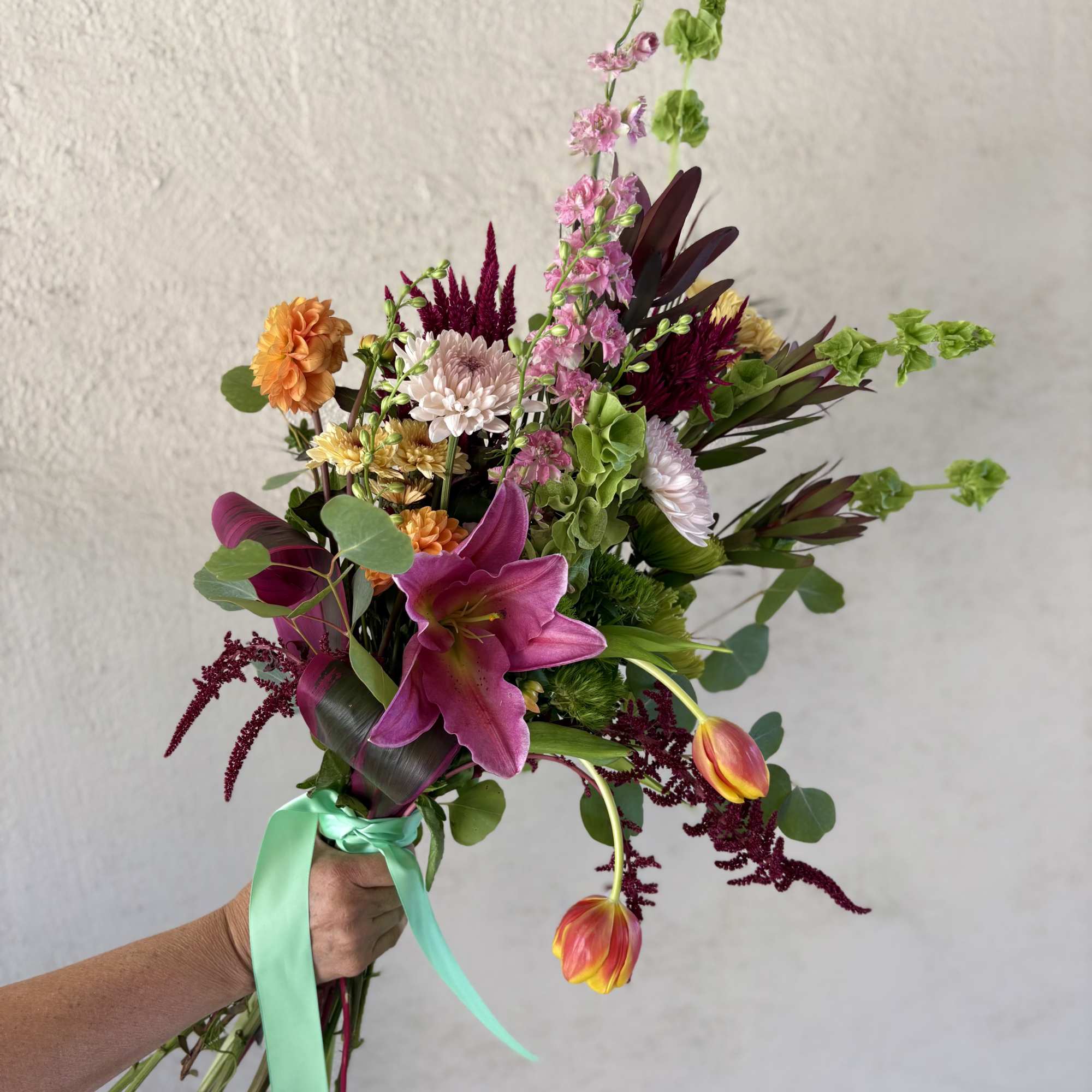 This weeks wrap includes pinks, greens, and oranges with Seasonal Dahlias, Amaranths