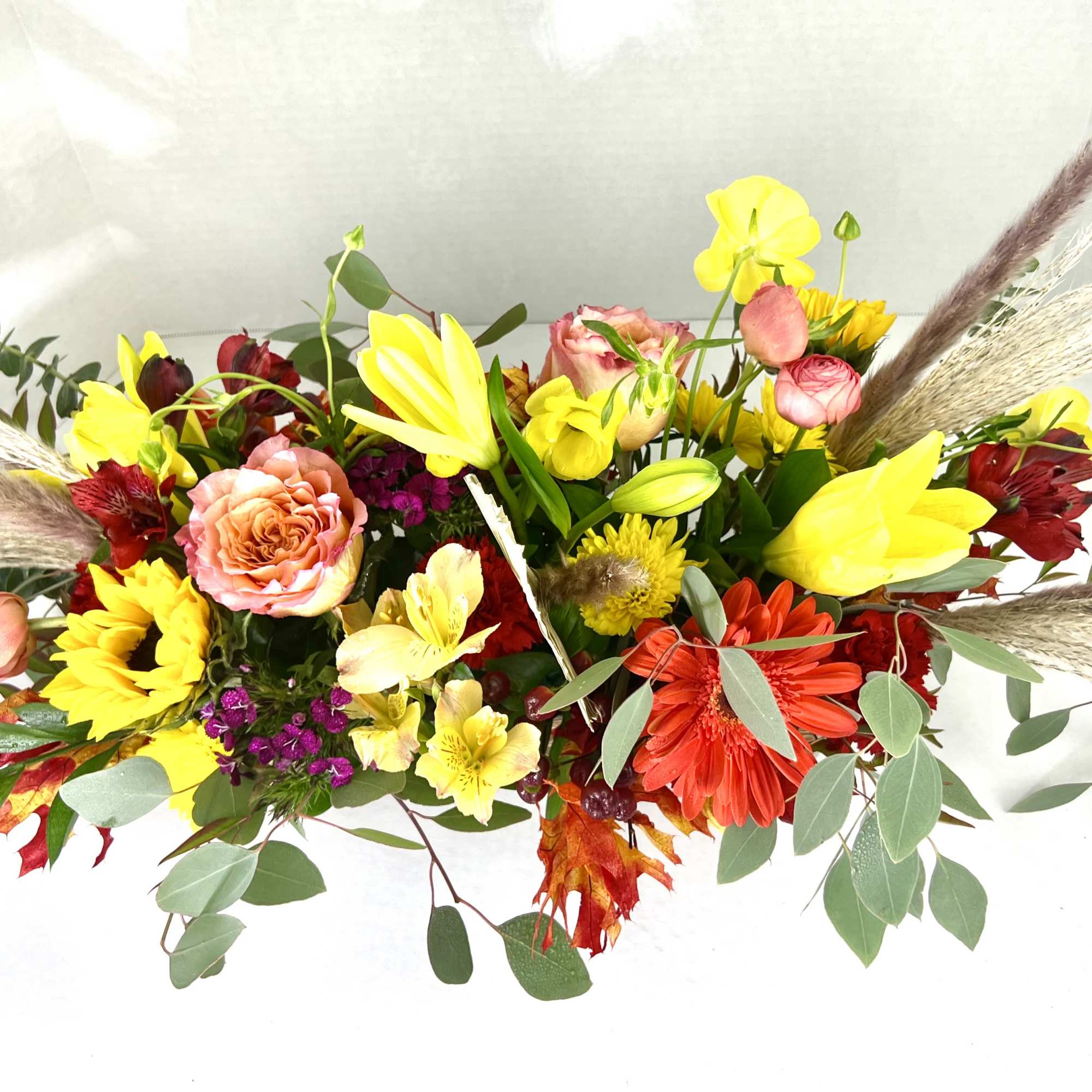 Fall flowers for the modern table in a trendy, dark wooden box.