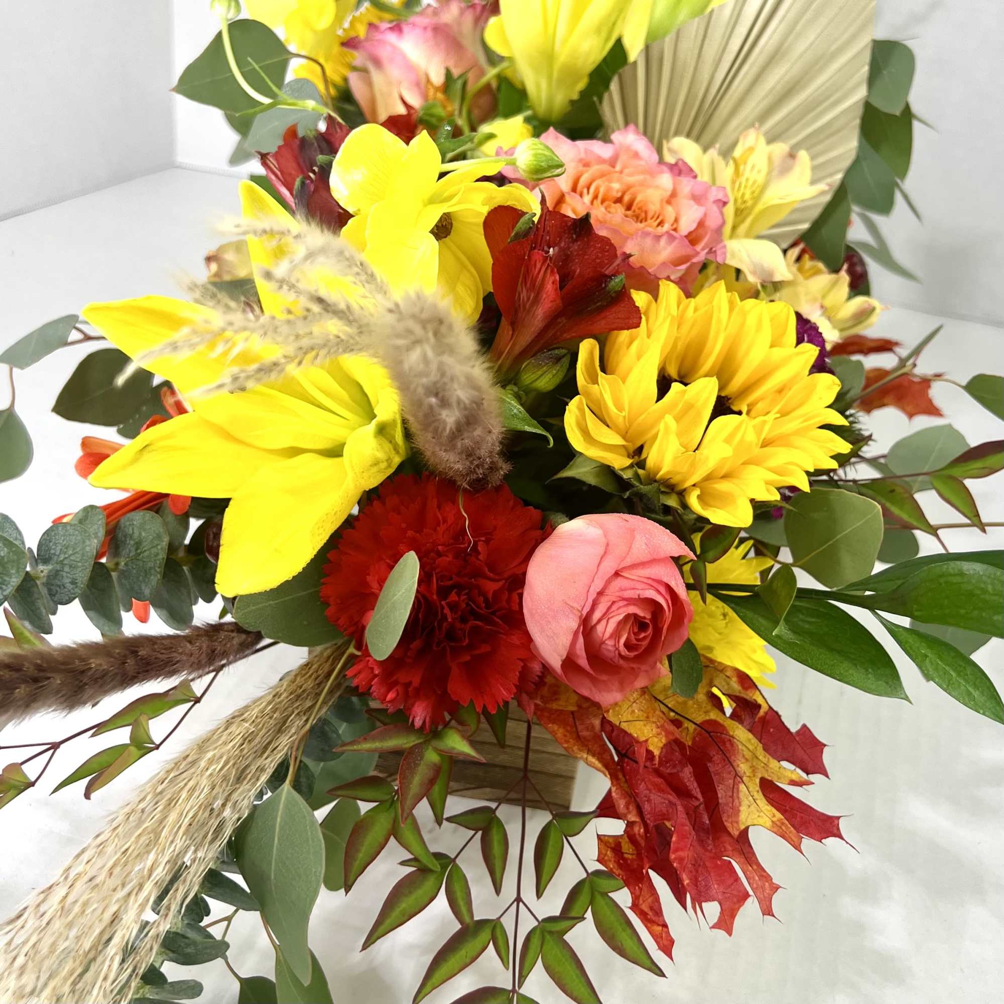 Fall flowers for the modern table in a trendy, dark wooden box.