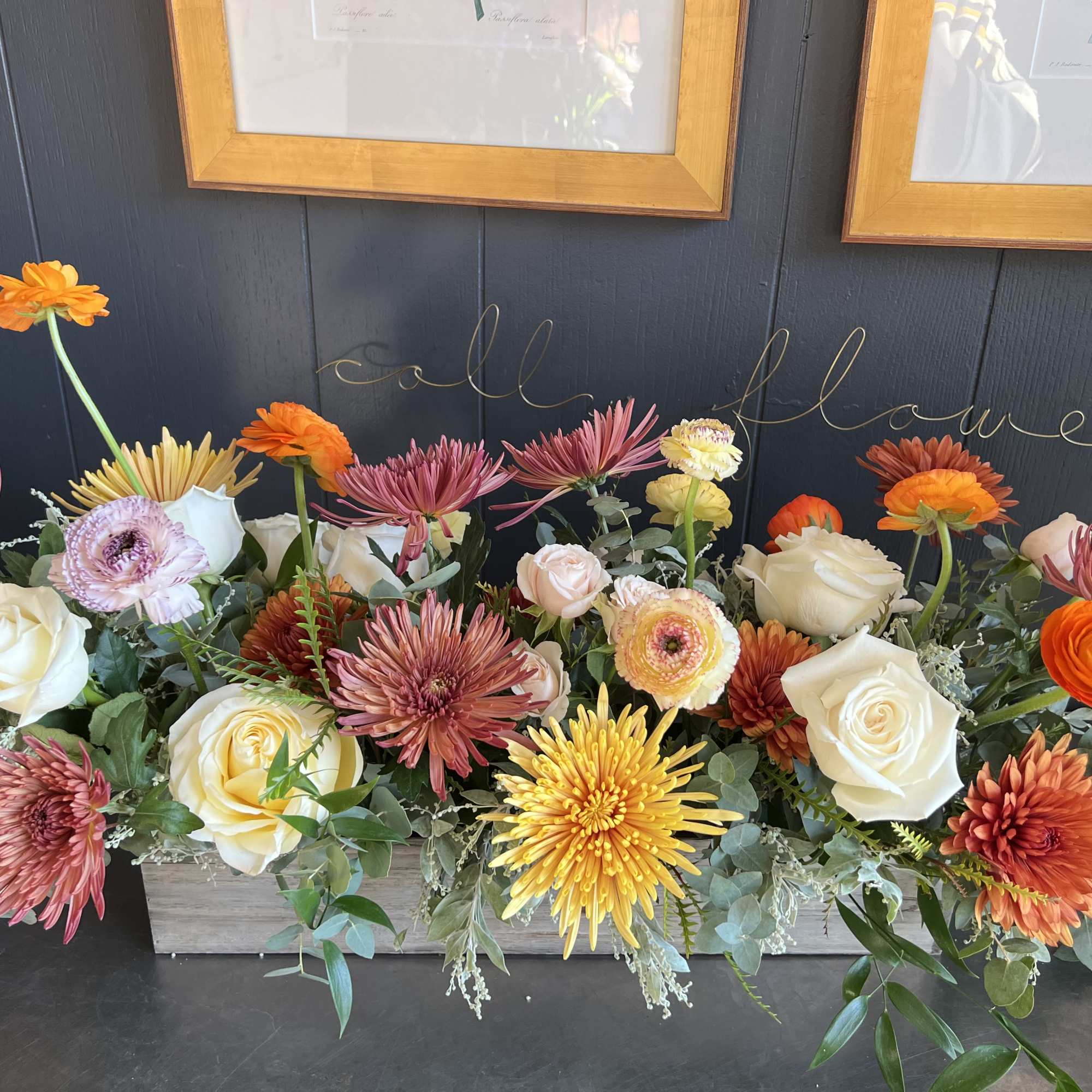 Arranged in a 20&rdquo; long rectangular wooden planter. This arrangement is a