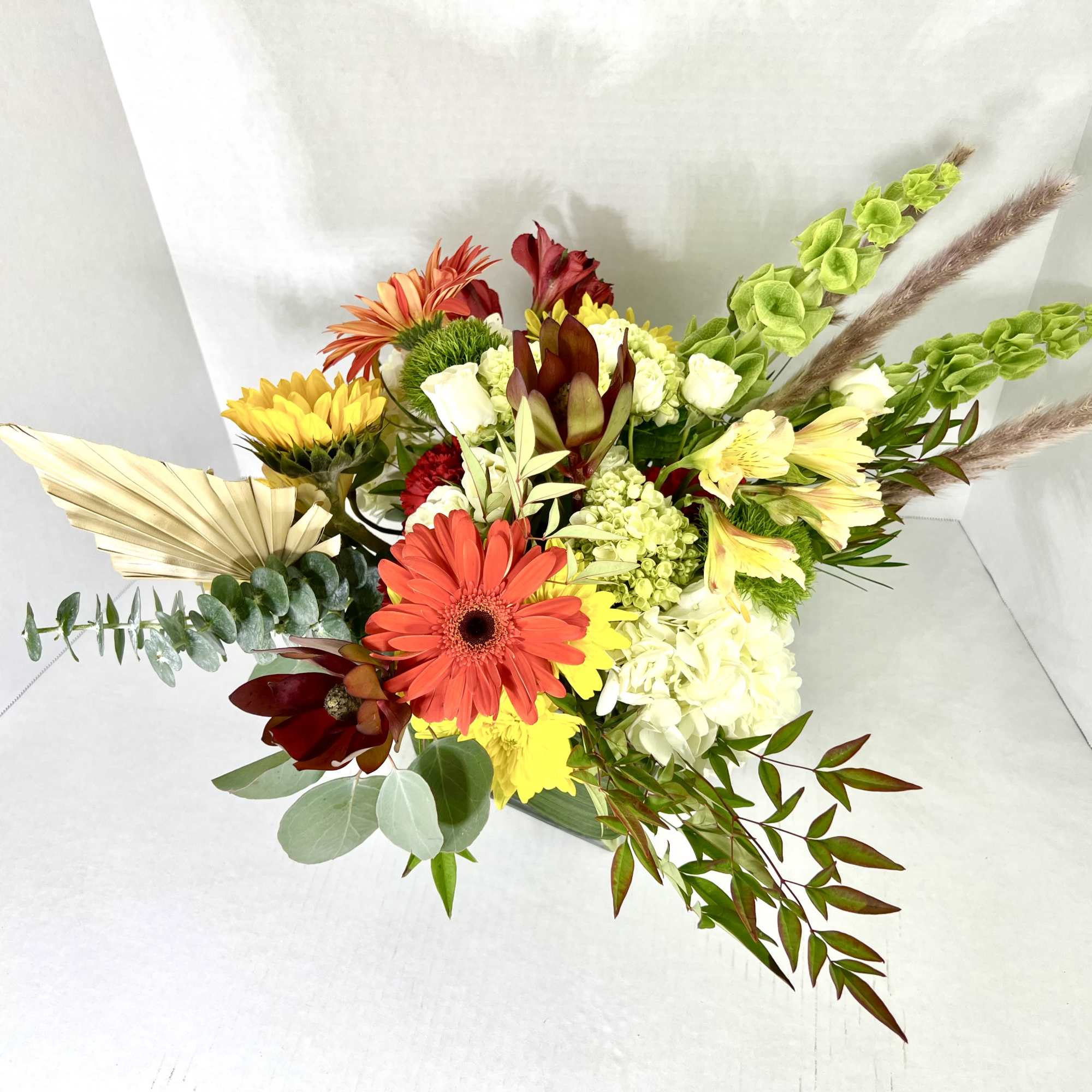 This is an extra large round Fall Centerpiece in a white Keepsake