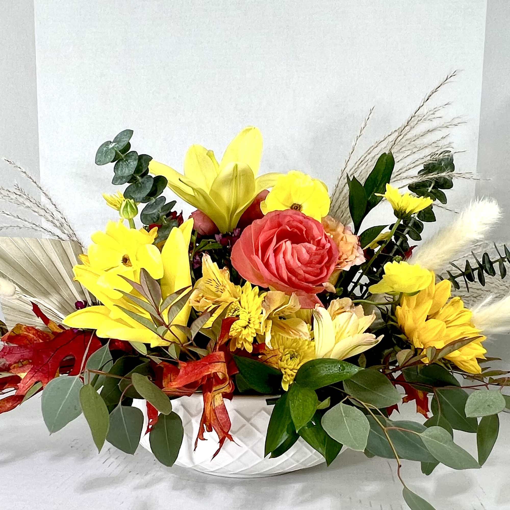 This is an extra large round Fall Centerpiece in a white Keepsake