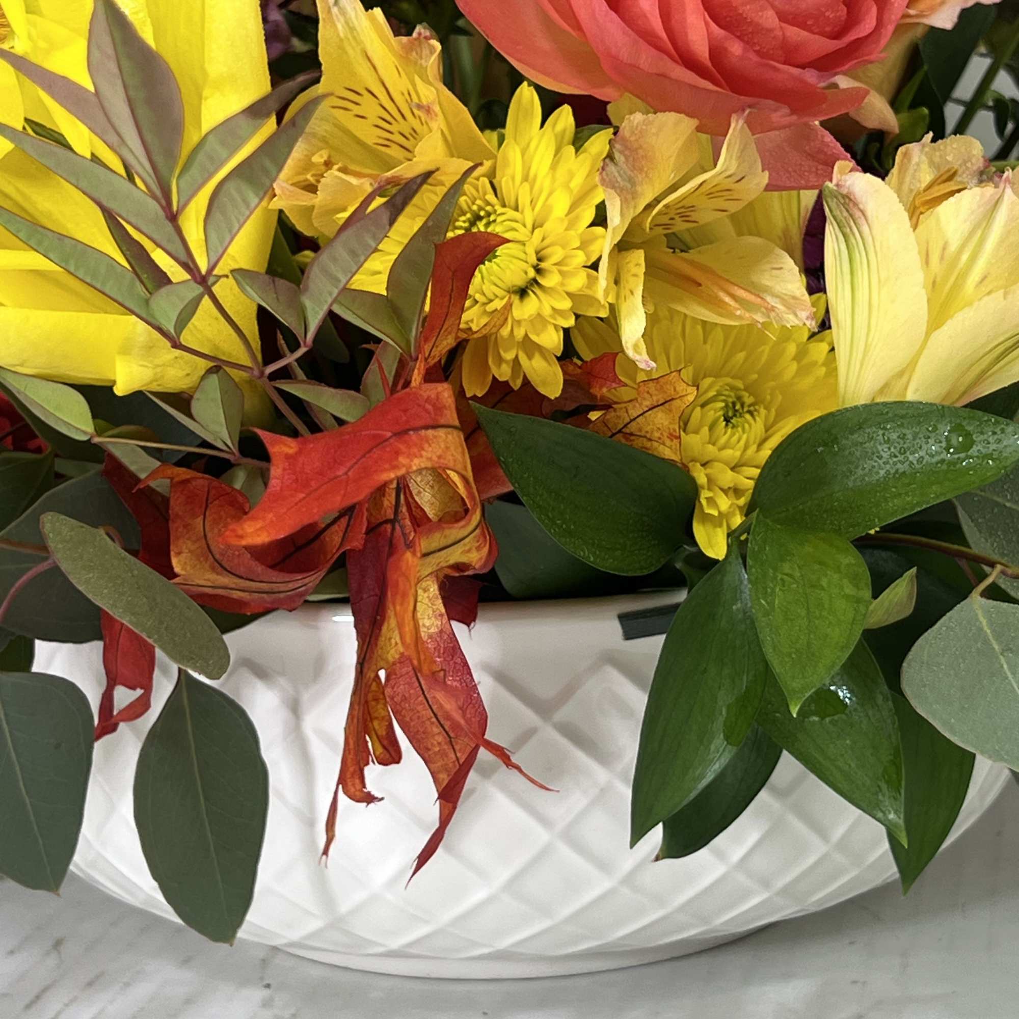 This is an extra large round Fall Centerpiece in a white Keepsake