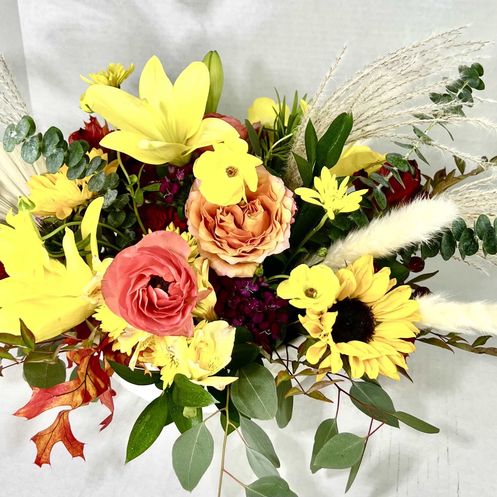 This is an extra large round Fall Centerpiece in a white Keepsake