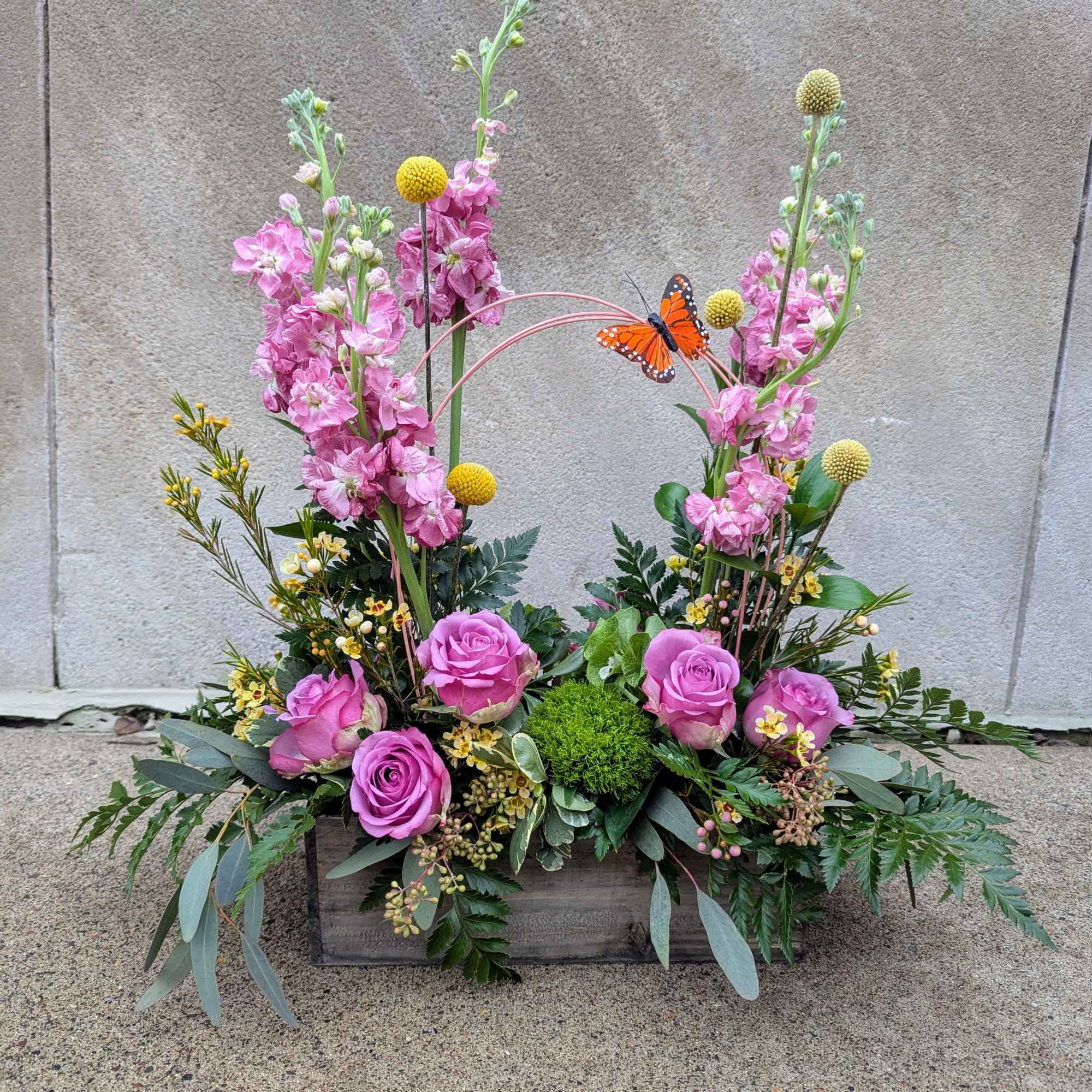Designer&#039;s choice of seasonal cut flowers and accents to include bright and