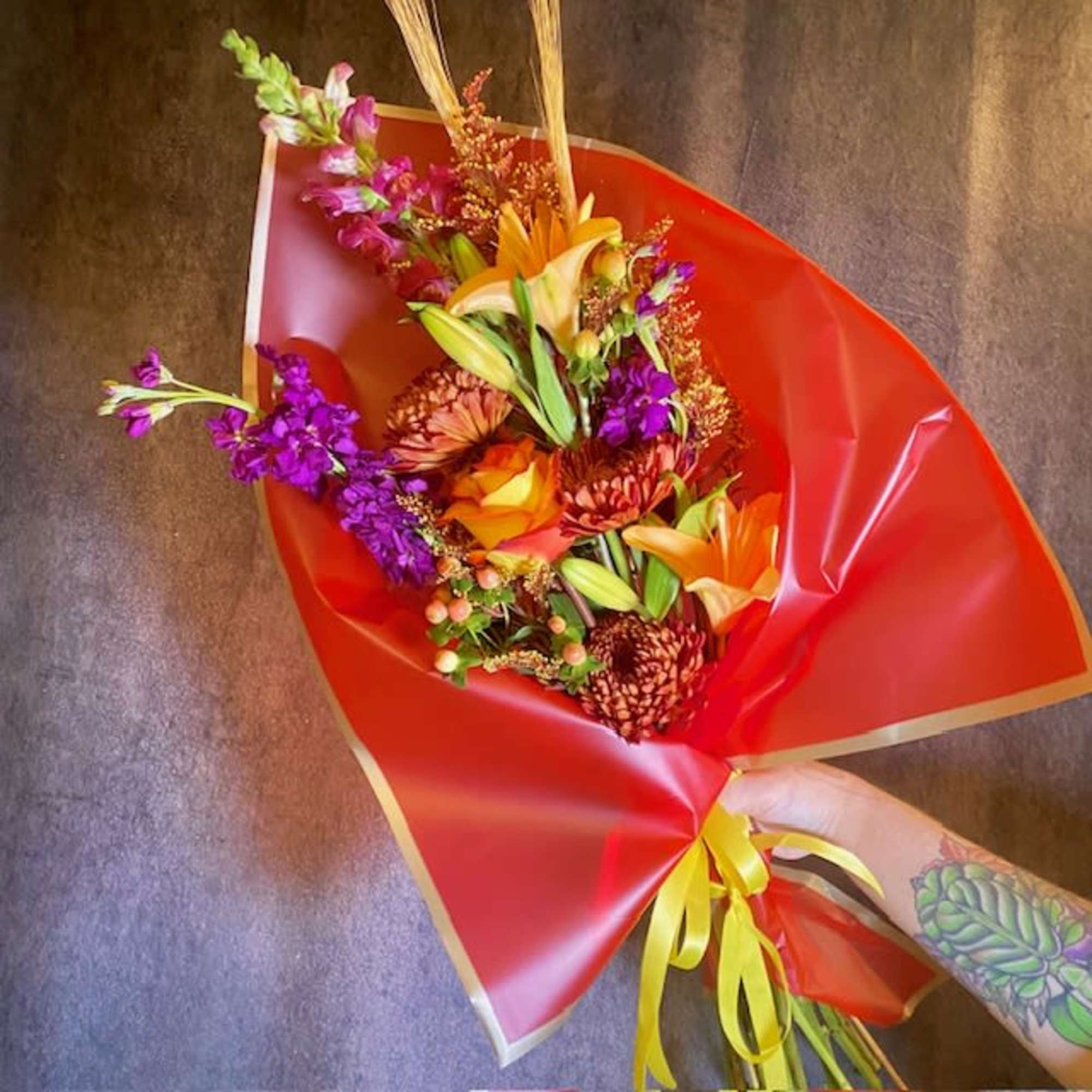 Autumnal charm radiates from this cozy and seasonal wrapped bouquet. The Bountiful