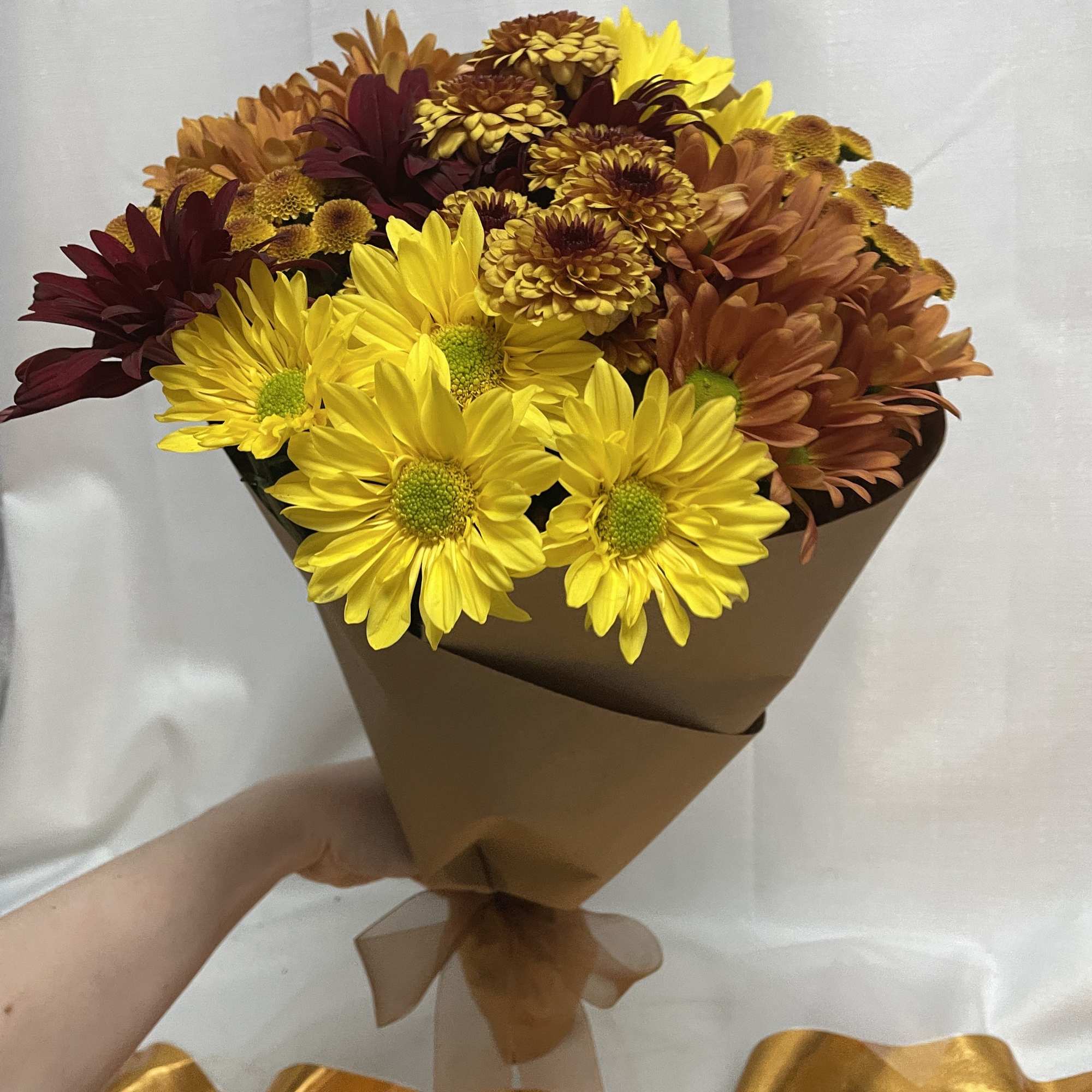 An assortment of fall daisies, certain to bring out a smile! Let