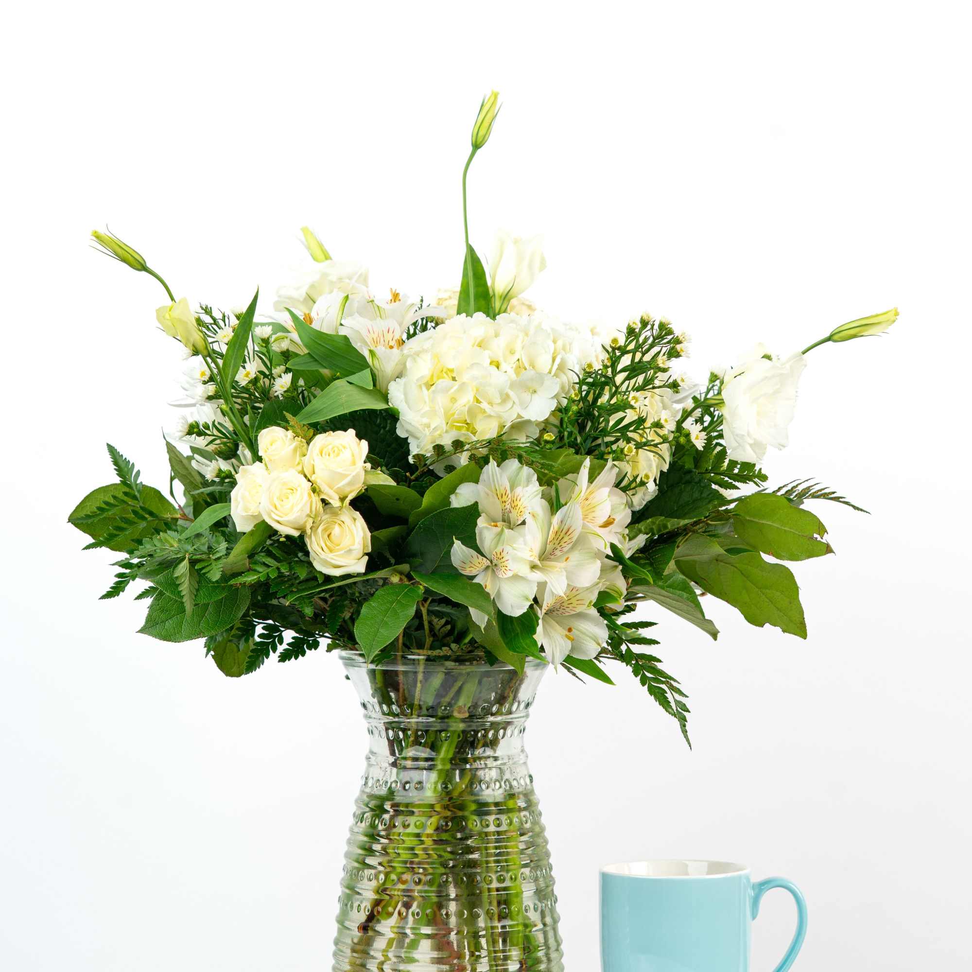 Our Timeless Collection's White Blooms features elegant blooms in soft ivory and/or