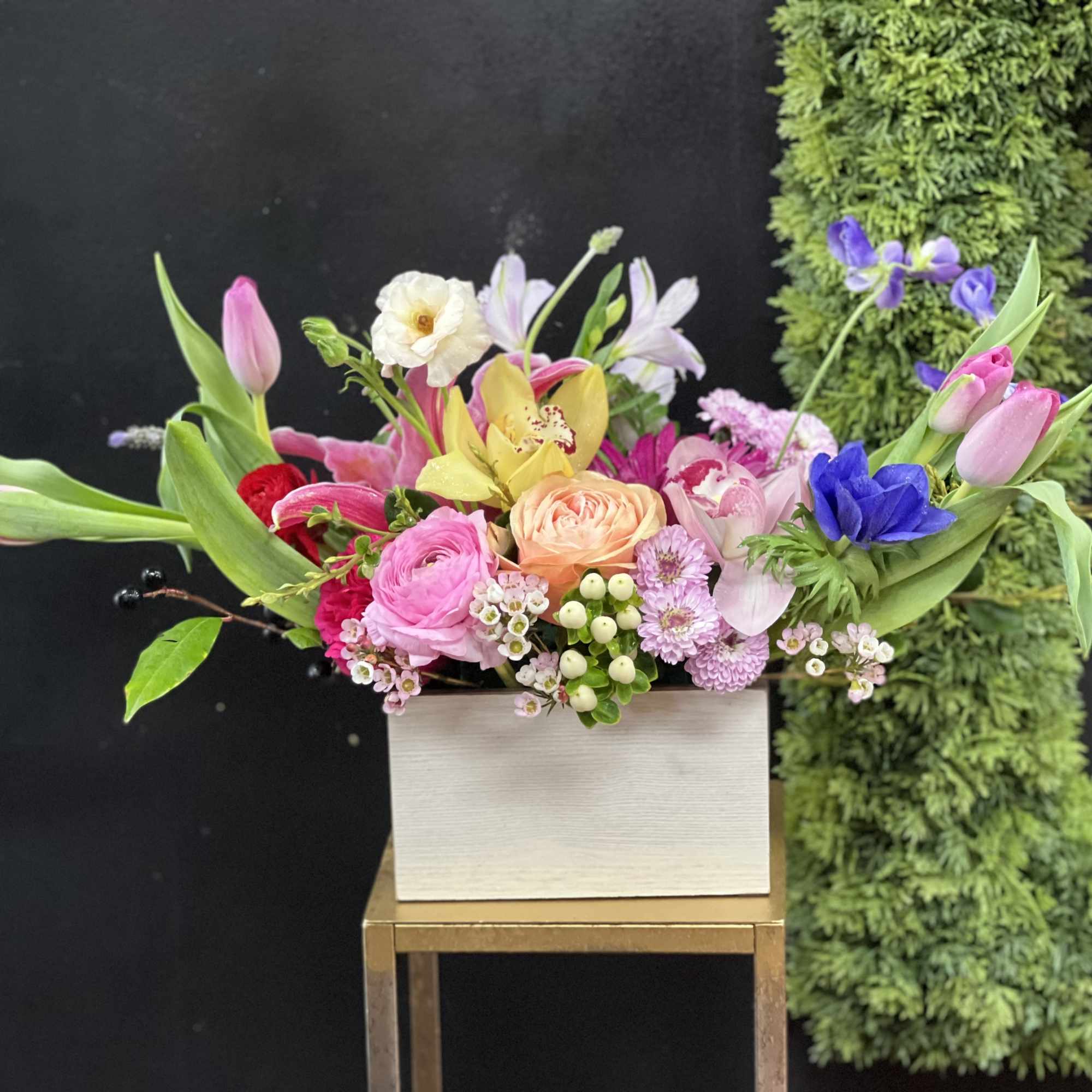 Vintage, rustic, bespoke style floral design arranged a wooden box or white