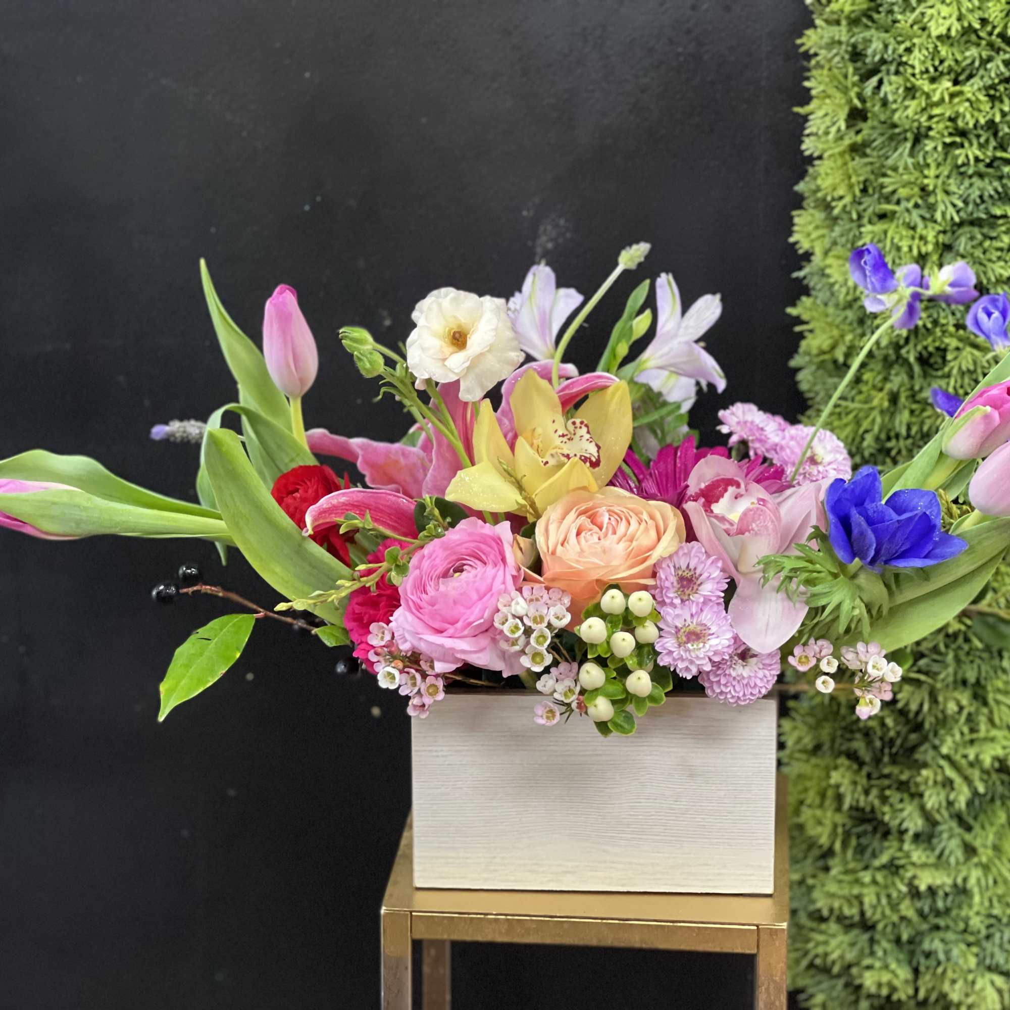 Vintage, rustic, bespoke style floral design arranged a wooden box or white