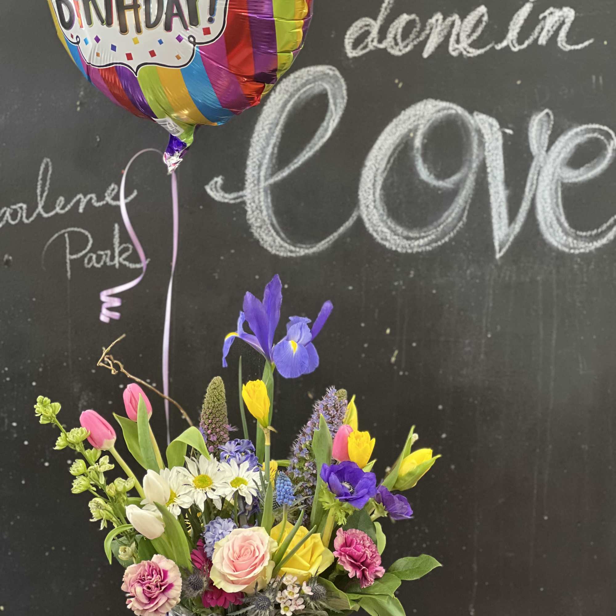 Vintage, rustic, bespoke style floral design arranged a wooden box or white