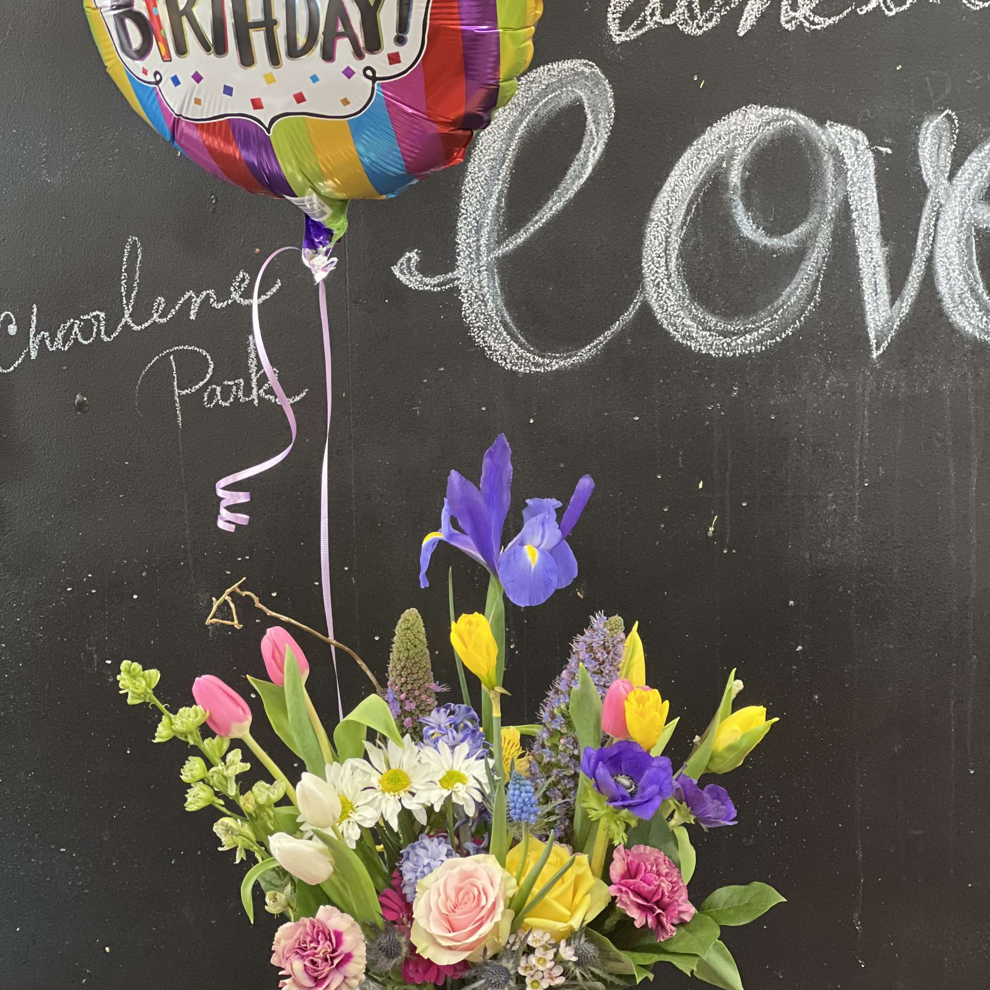 Vintage, rustic, bespoke style floral design arranged a wooden box or white