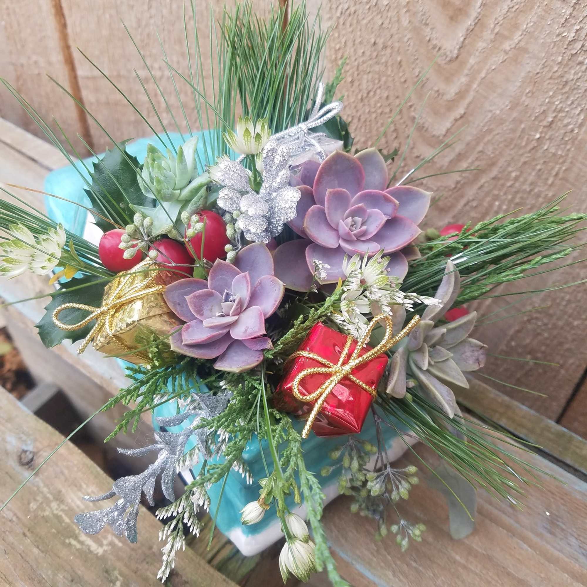 This charming old fashioned truck has a bed filled with fresh pine