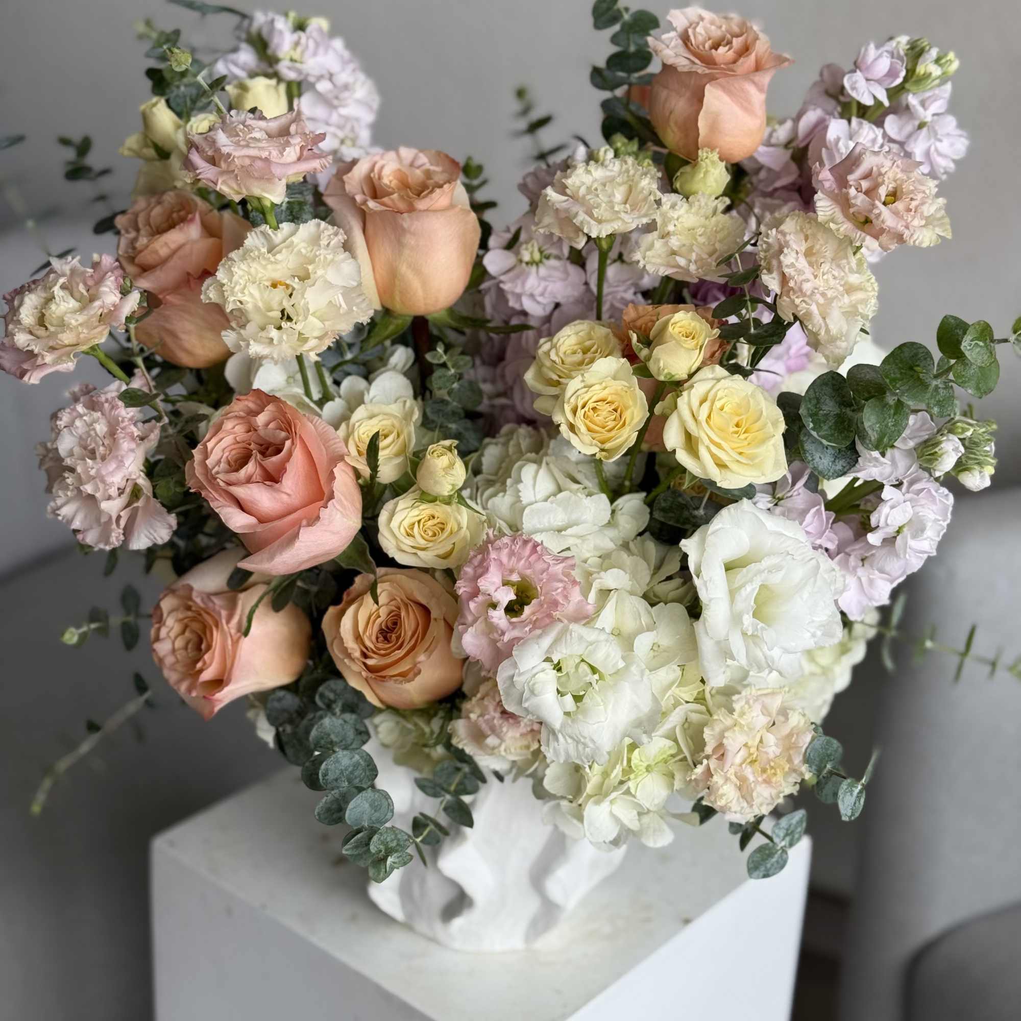 A radiant burst of summer elegance, Sun-Kissed Peach features lush peach roses