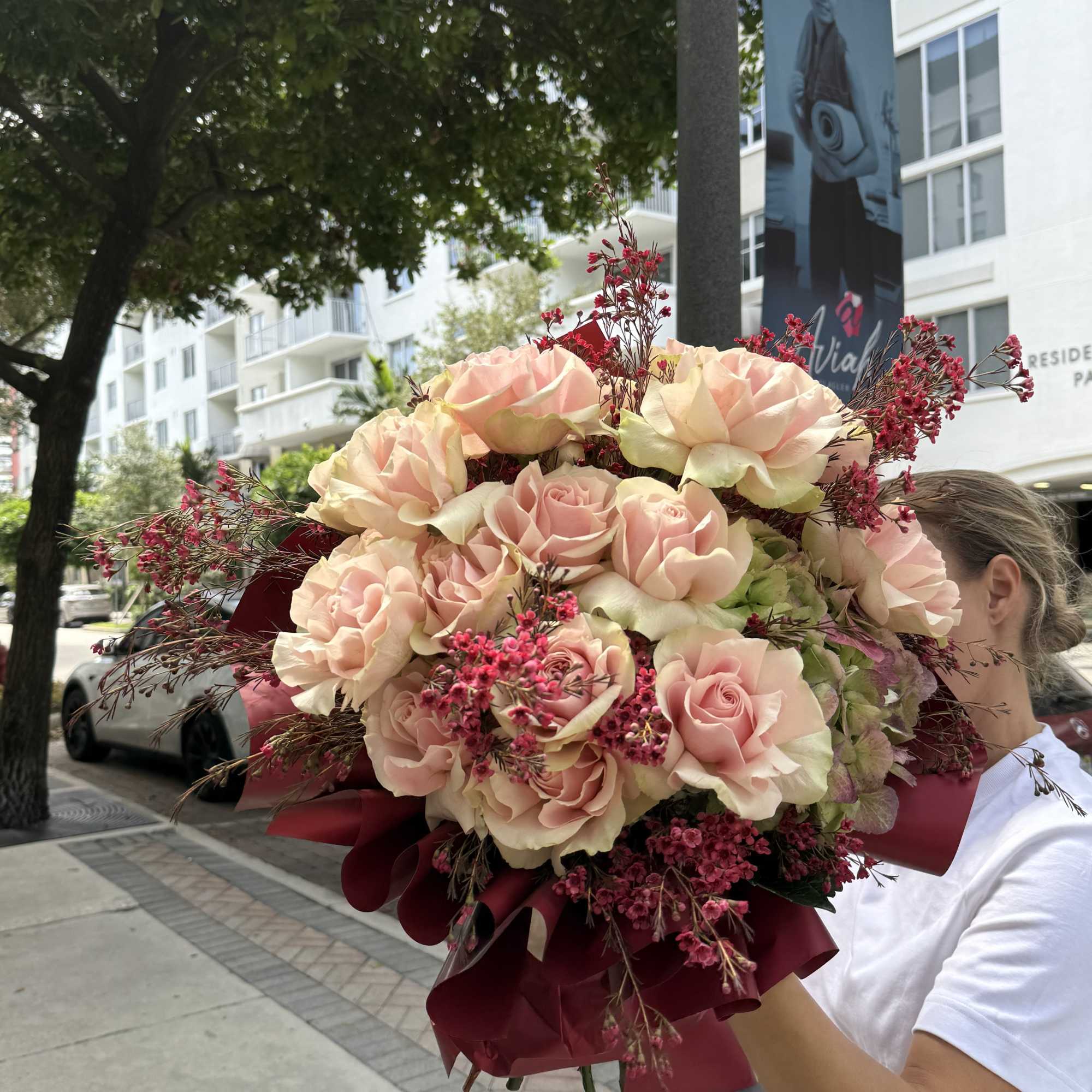 Burgundy Charm is a romantic bouquet featuring soft blush roses paired with