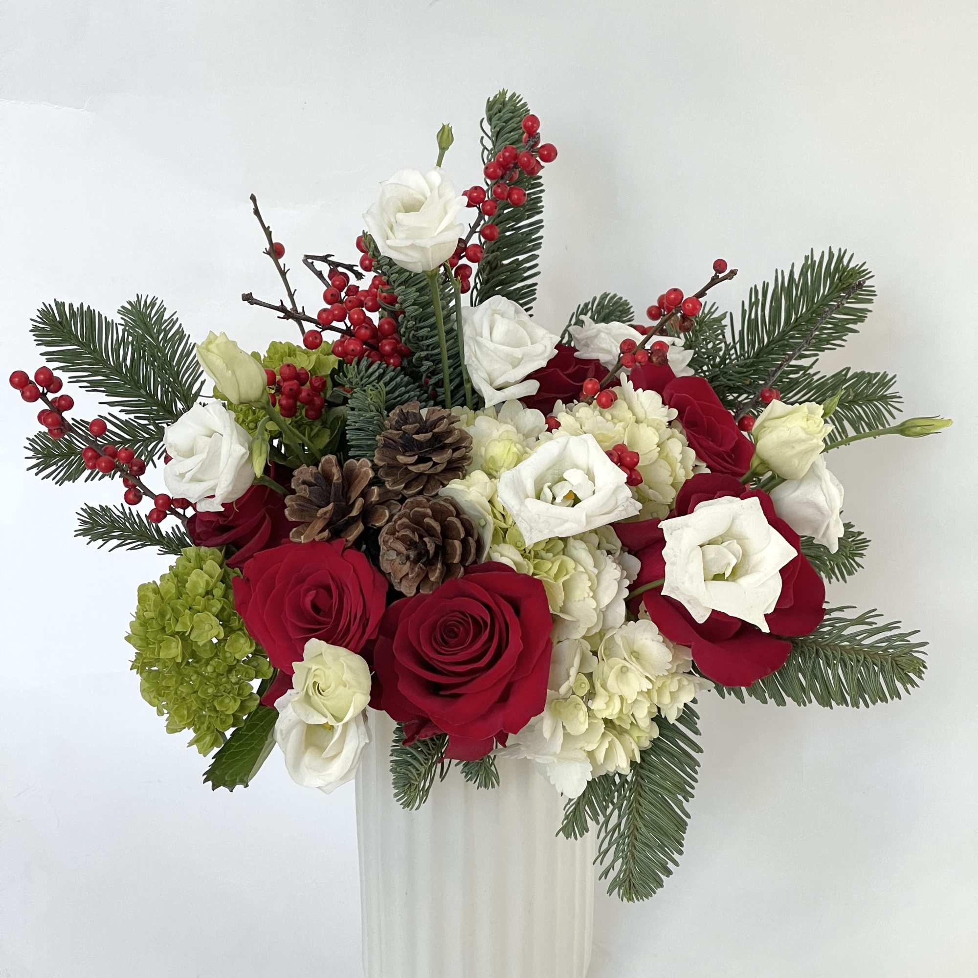 This arrangement is presented in a 8&quot;*4&quot;*4&quot; white ceramic vase. An elegant