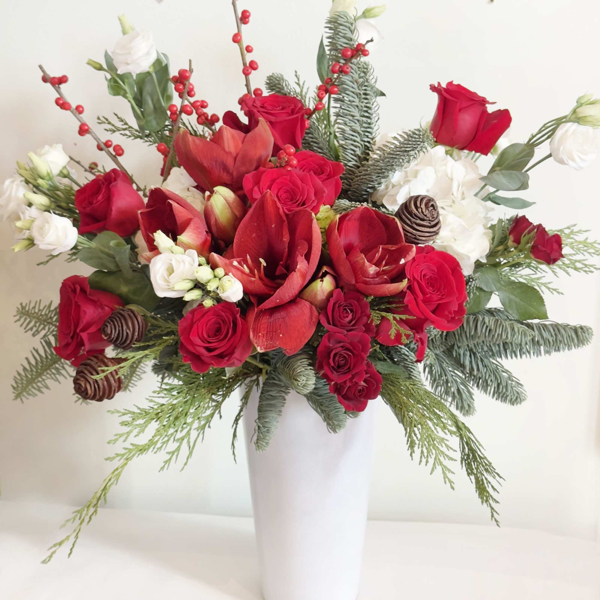 This arrangement is presented in a 11&quot; tall white glass vase. It