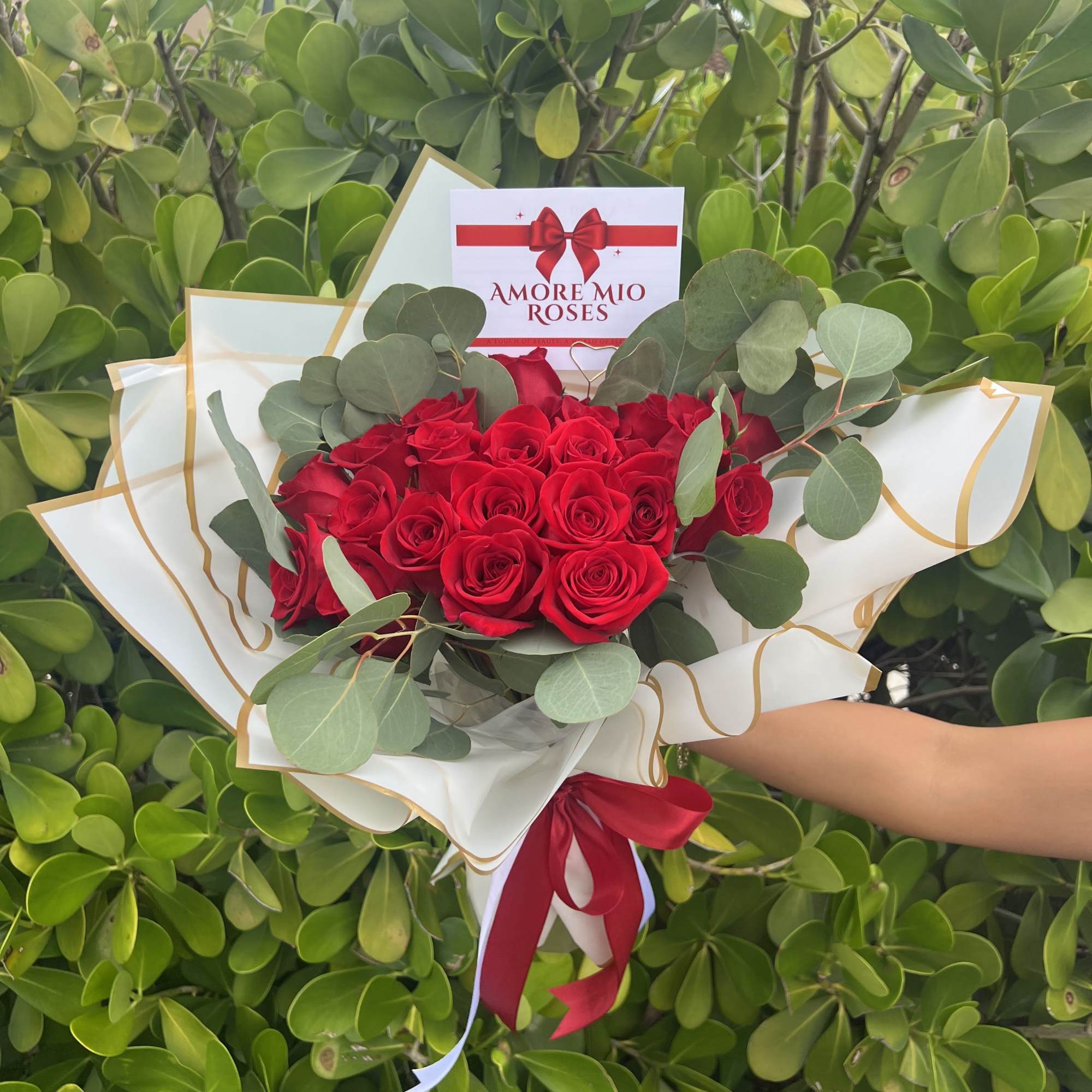 Elevate any occasion with this expertly arranged bouquet of fresh roses complemented