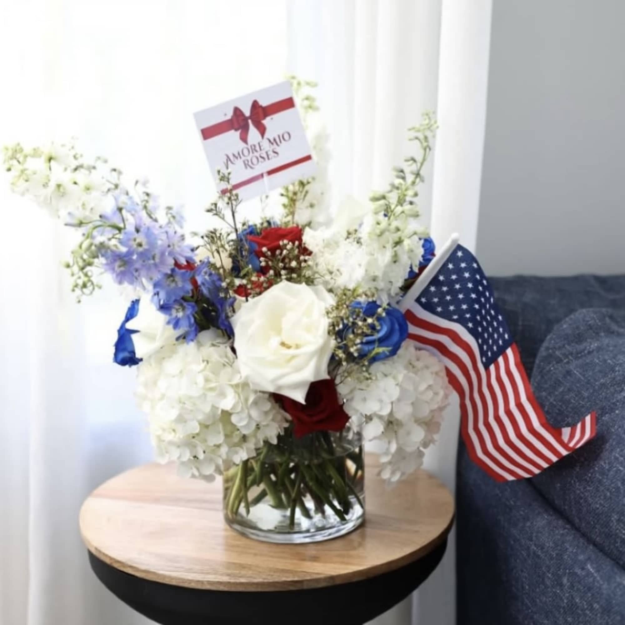 Celebrate American pride with this vibrant red, white, and blue centerpiece arranged